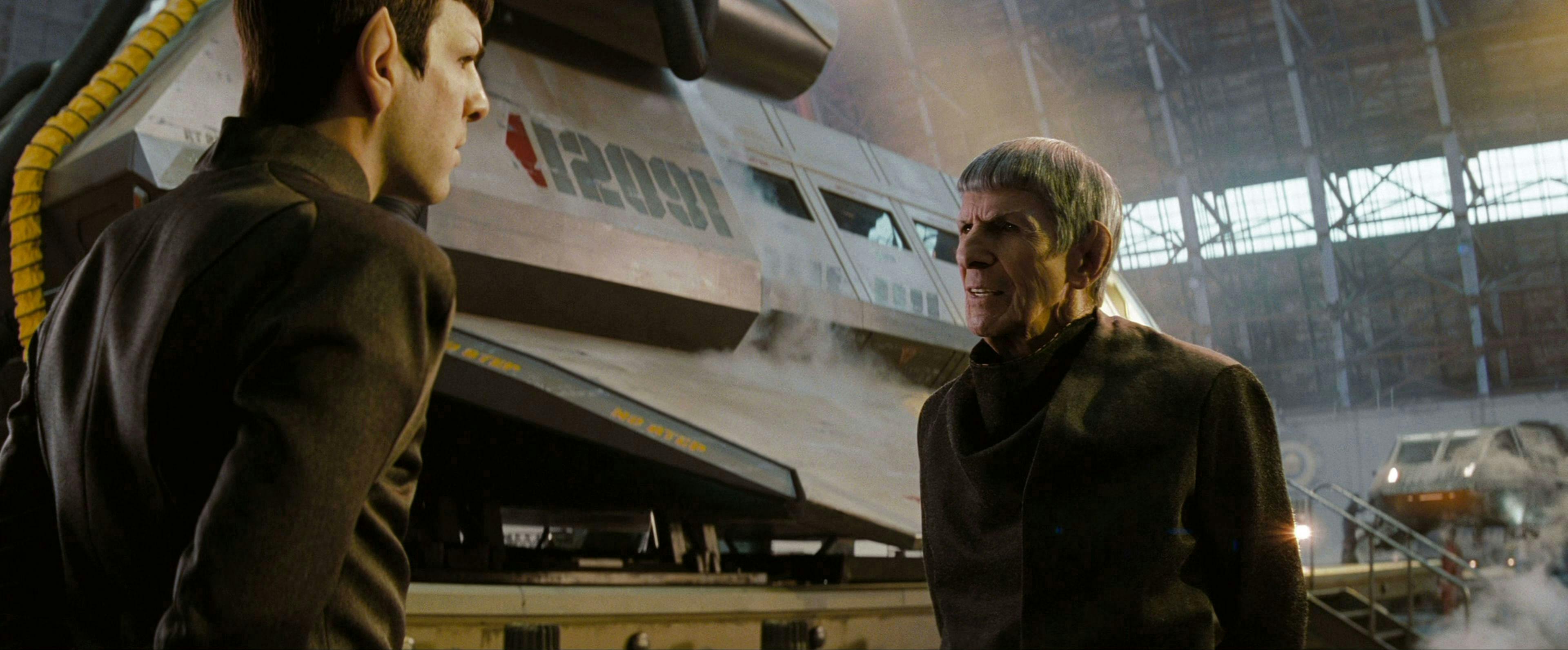 Breaking temporal rules, Prime Spock meets with Kelvin Spock beside a shuttle in Star Trek (2009)
