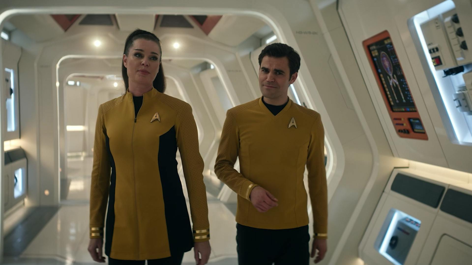 Number One Una and James T. Kirk walk the corridor of the U.S.S. Enterprise in 'Subspace Rhapsody'
