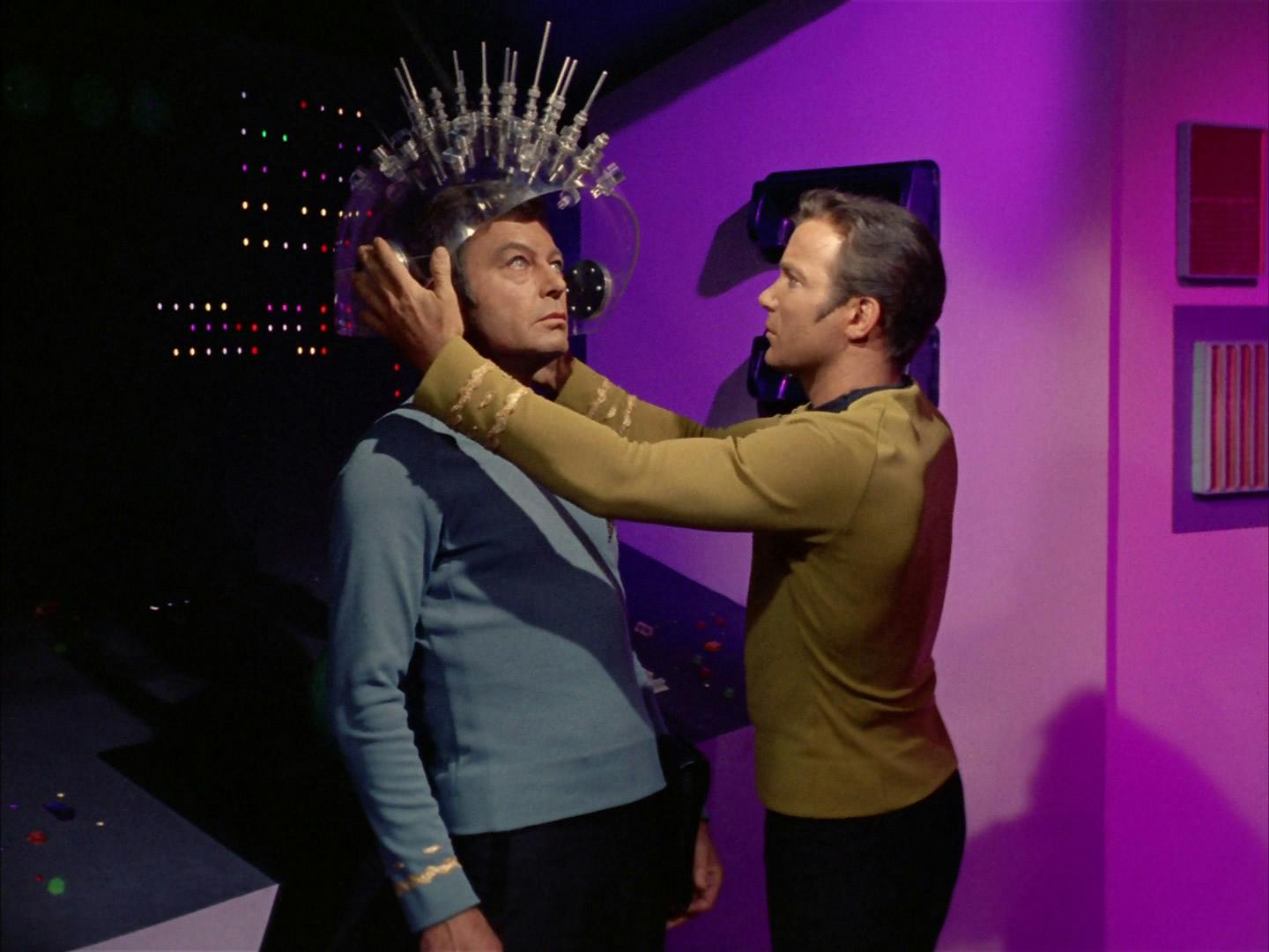 James Kirk places the teacher device on McCoy who endures the pain of the Teacher's lessons in 'Spock's Brain'