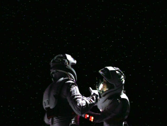 In their EV suits, Tom Paris and B'Elanna float aimlessly in space as they lose oxygen supplies in 'Day of Honor'