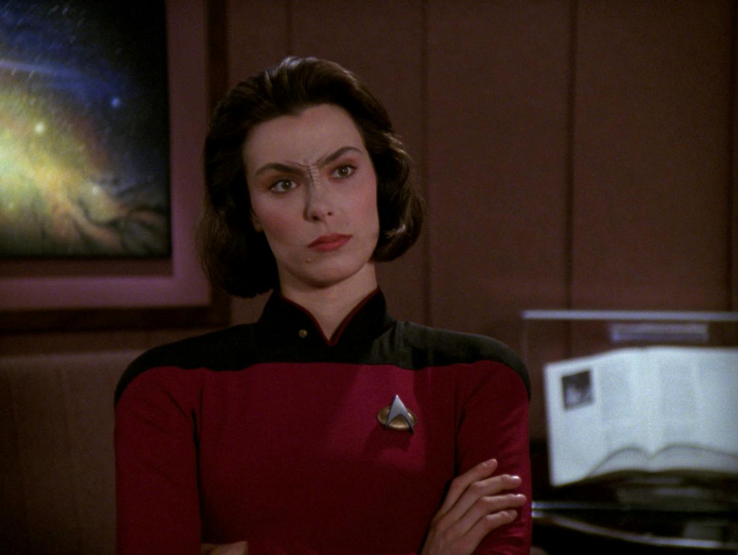 In Picard's Ready Room, Ro Laren displays her typical demeanor - surly, arms crossed - in 'Ensign Ro'