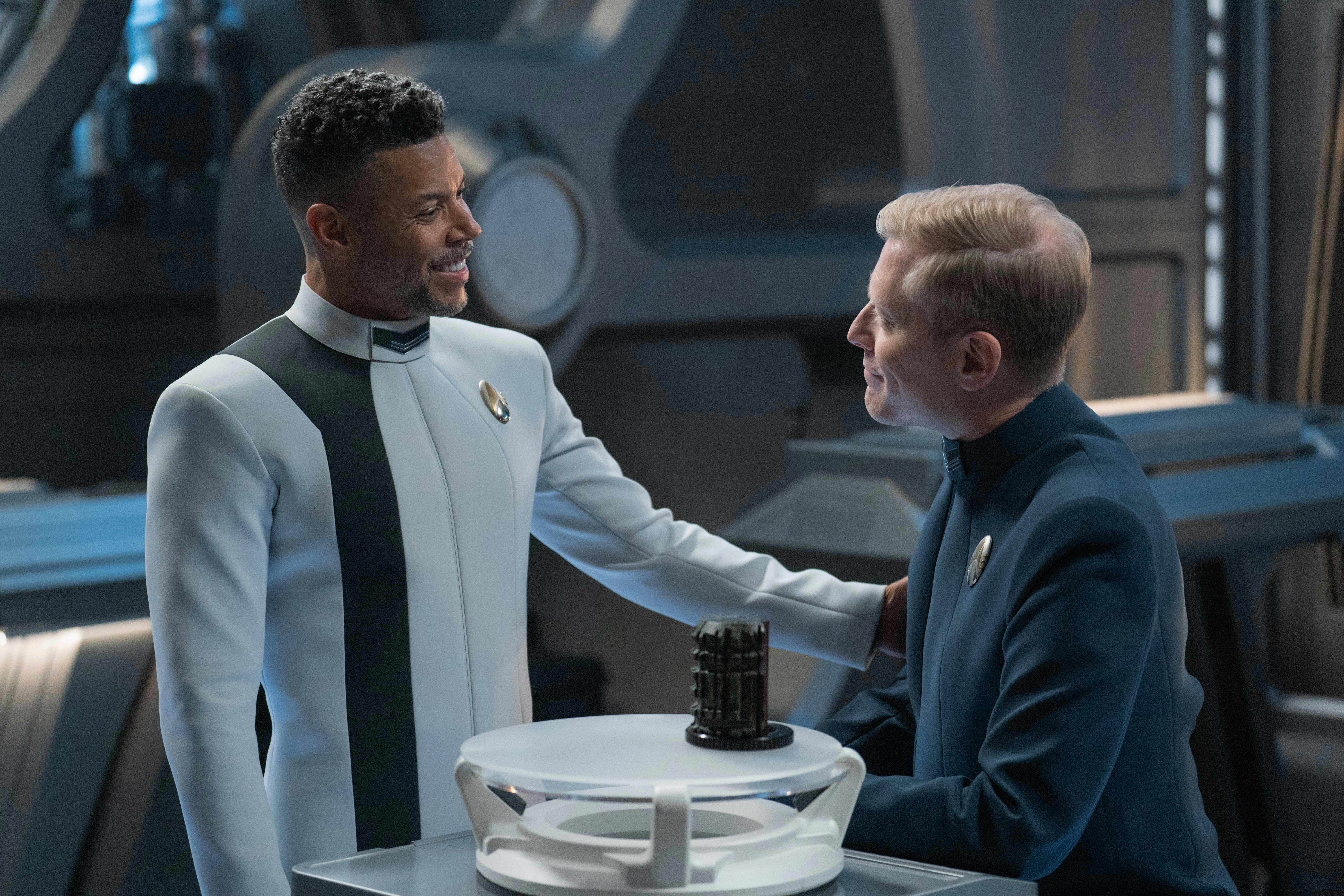 Culber approaches Stamets in the Engineering lab and places his hand on Paul's arm with the pieces of clues between them  in 'Whistlespeak'