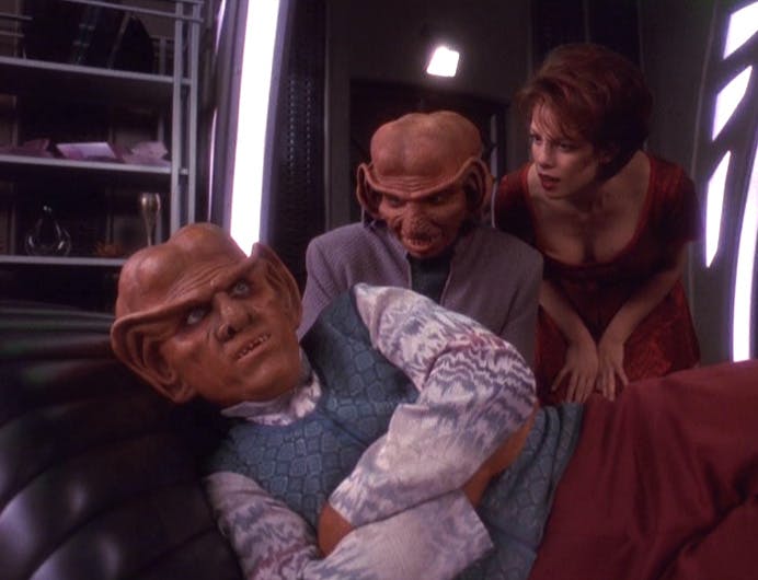 In the study, Rom and Leeta bend over to Quark who lays in the chaise in 'Ferengi Love Songs'