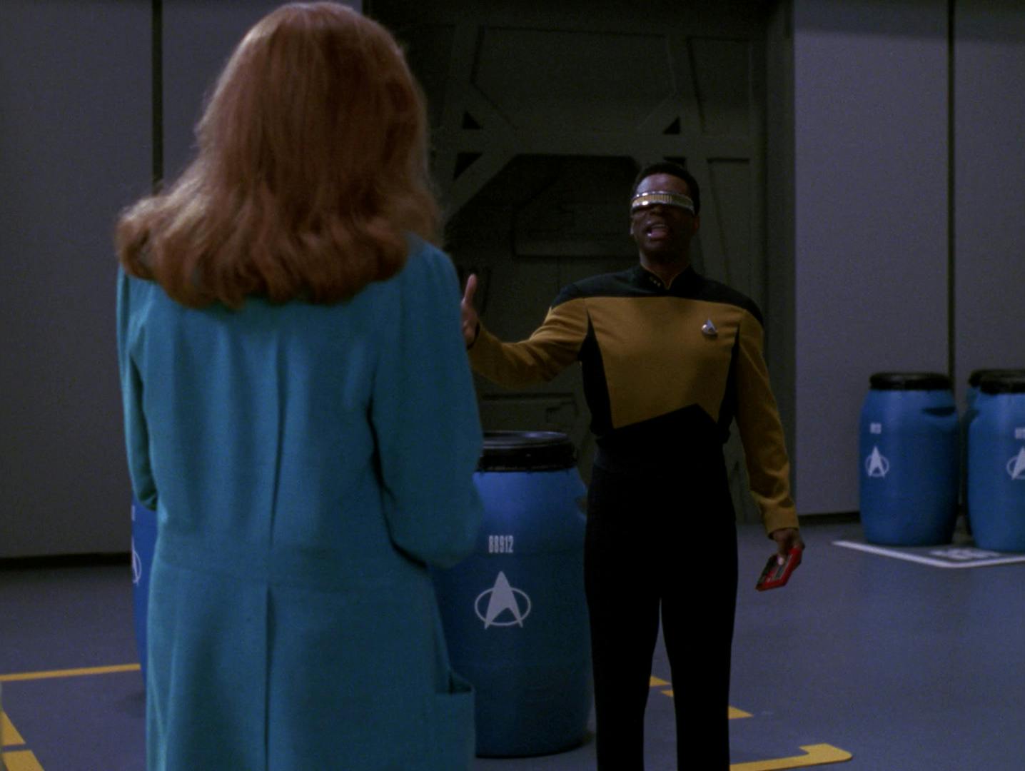 Beverly Crusher convinces Geordi La Forge to sing Gilbert and Sullivan in the repair bay on the Enterprise-D in 'Disaster'