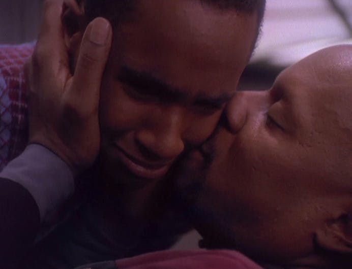 Ben Sisko pulls in an emotional Jake into a tender moment as his son is distraught in 'The Visitor'