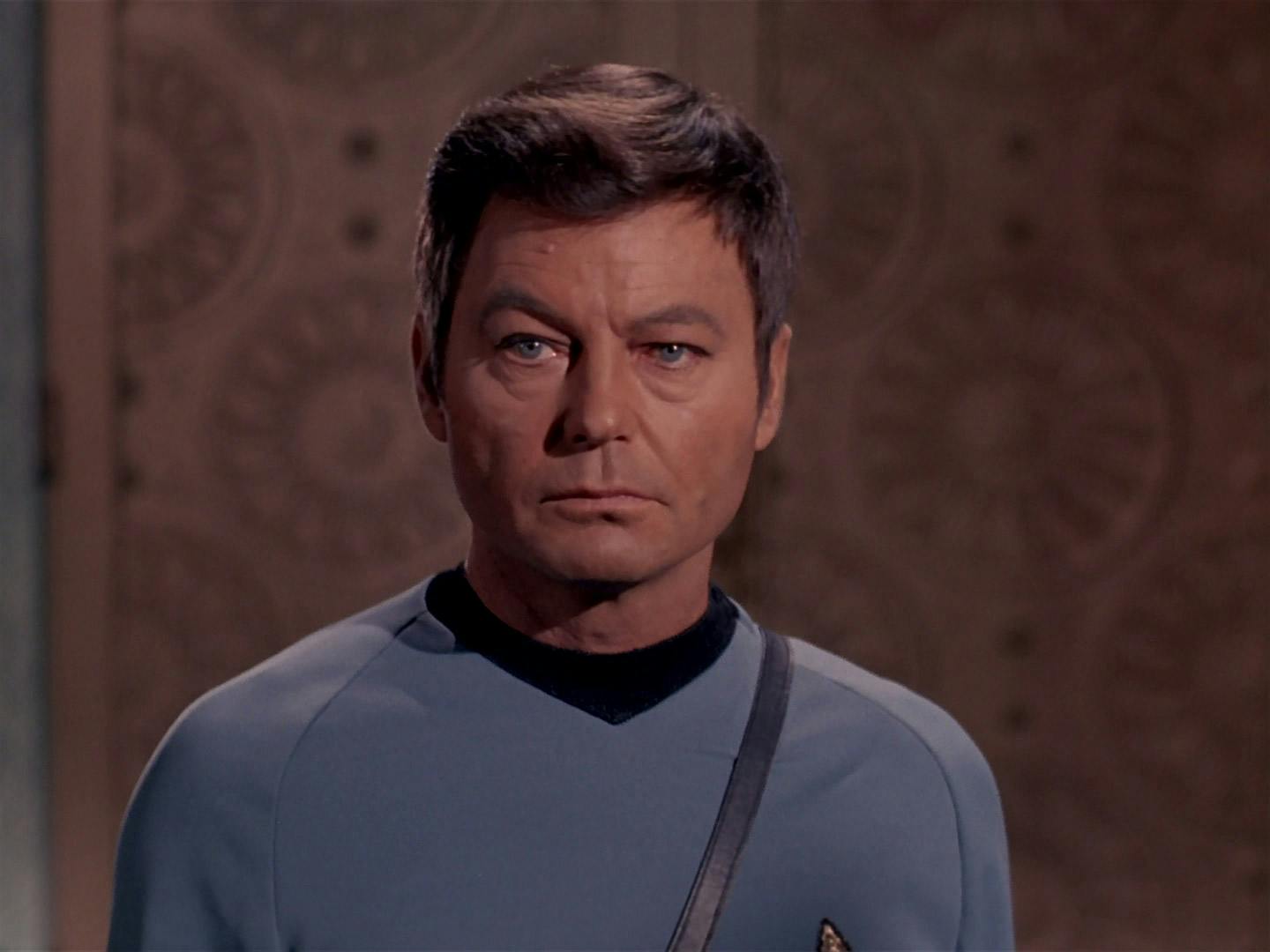 Dr. Leonard 'Bones' McCoy weighs remaining on the planet with the Platonians in order for his crew to leave on the Enterprise in 'Plato's Stepchildren'