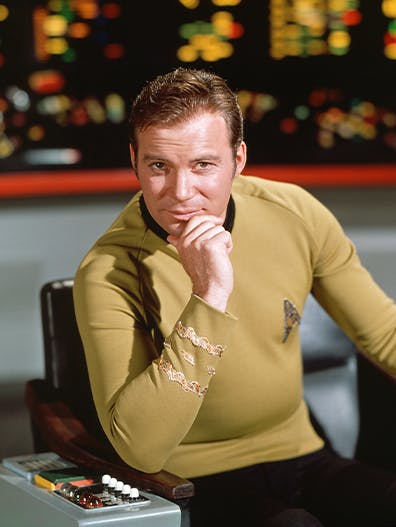 James T. Kirk sits in the captain's chair on the bridge of the U.S.S. Enterprise as seen in Star Trek: The Original Series