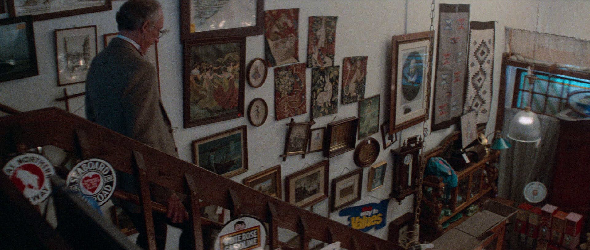 As the clerk descends the staircase at an antique shop in San Francisco, spotted on the wall is a portrait of William Shakespeare in Star Trek: The Voyage Home