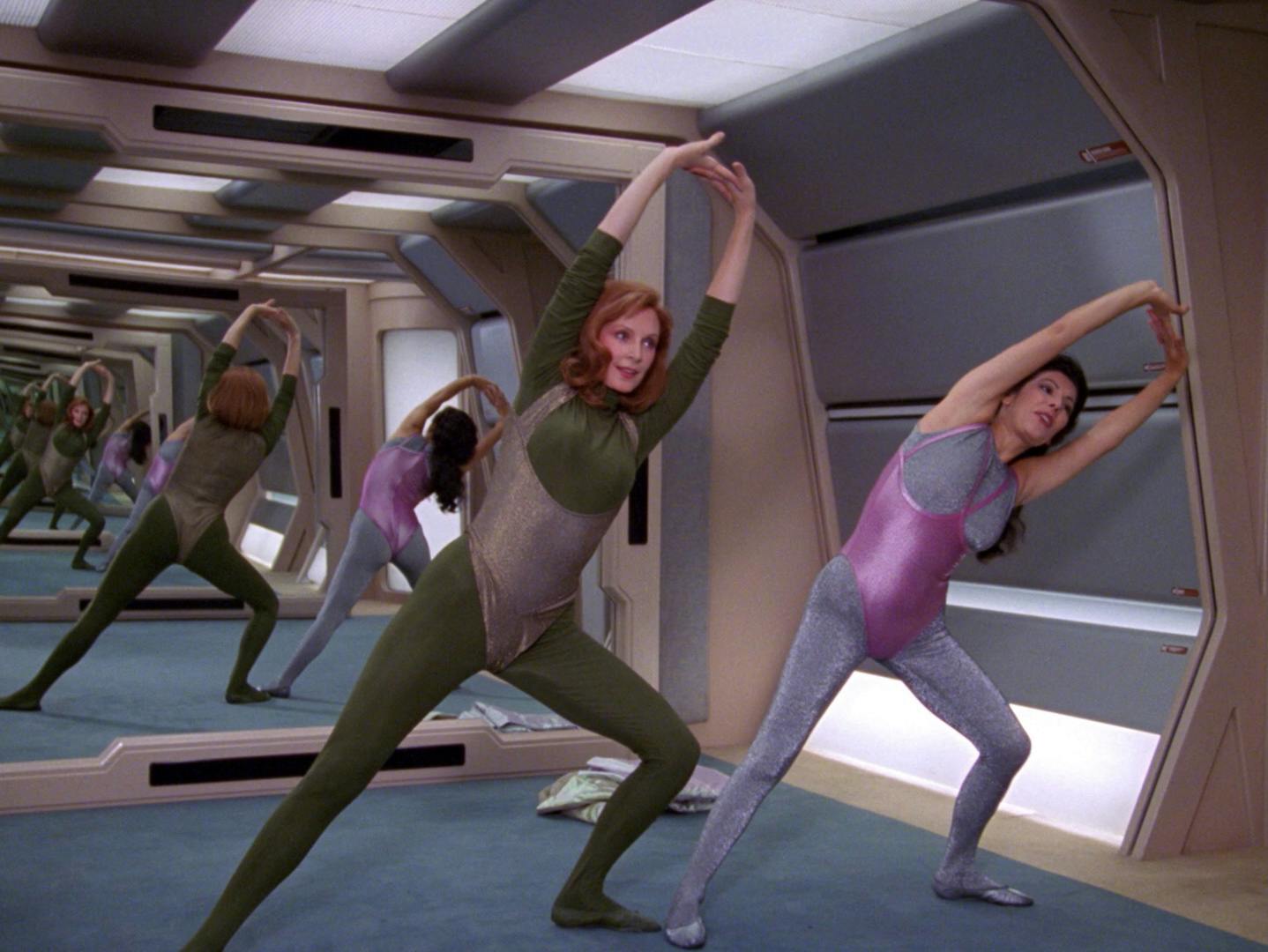Beverly Crusher and Deanna Troi take time out of their schedule for light aerobic stretching in 'The Price'