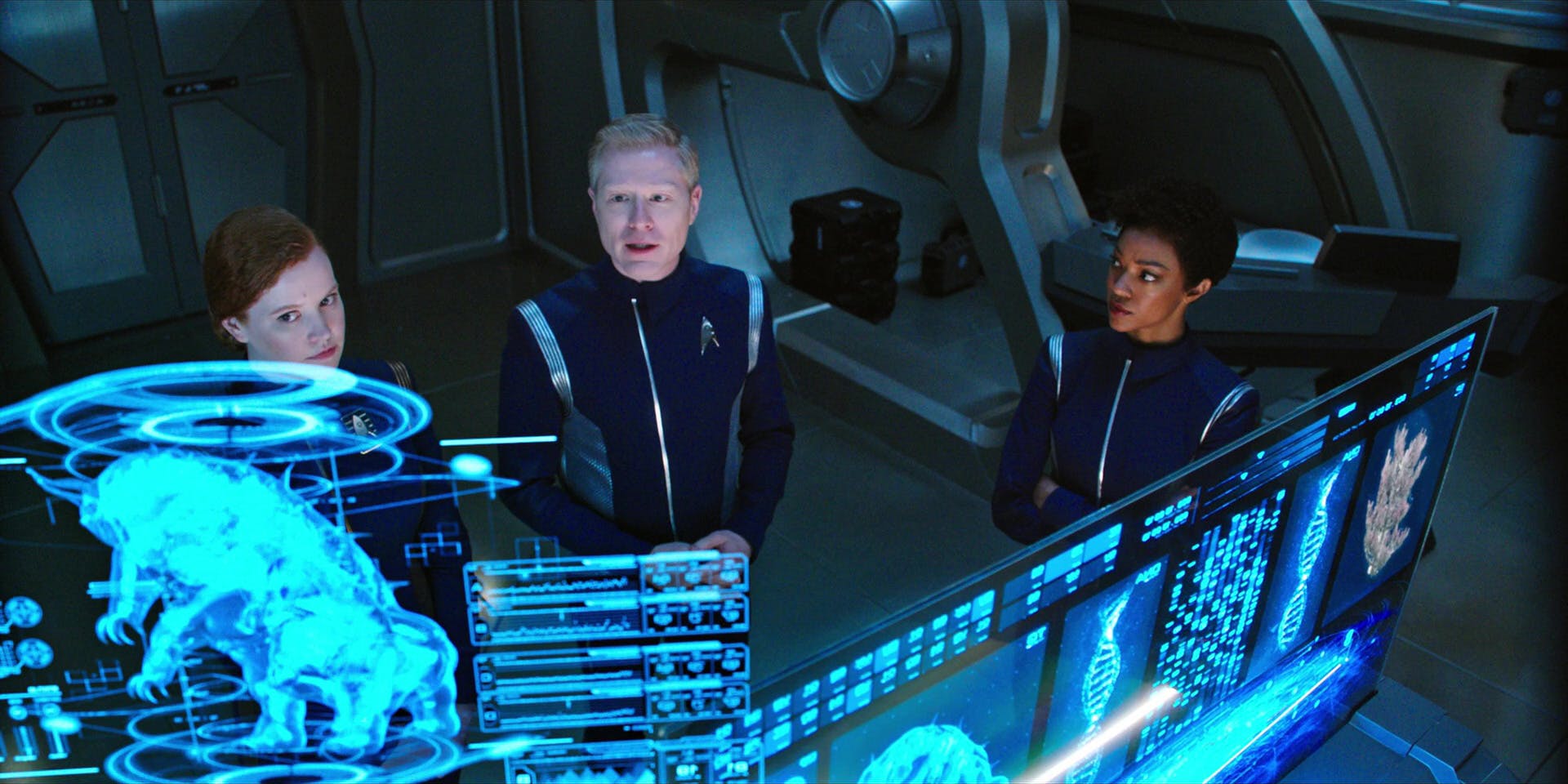 In the science lab, Tilly, Stamets, and Michael Burnham look at the lab reports of Ripper the Tardigrade in 'Choose Your Pain'