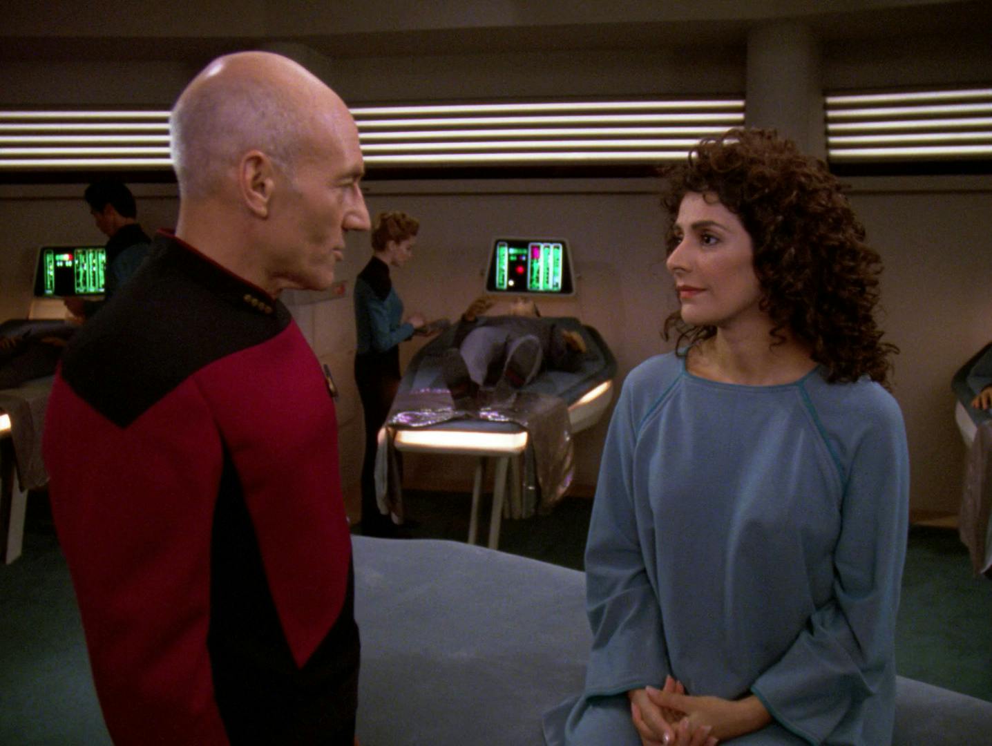 Picard checks in on Deanna Troi in Sickbay following her ordeal as posing as a Tal Shiar on a Romulan warbird in 'Face of the Enemy'