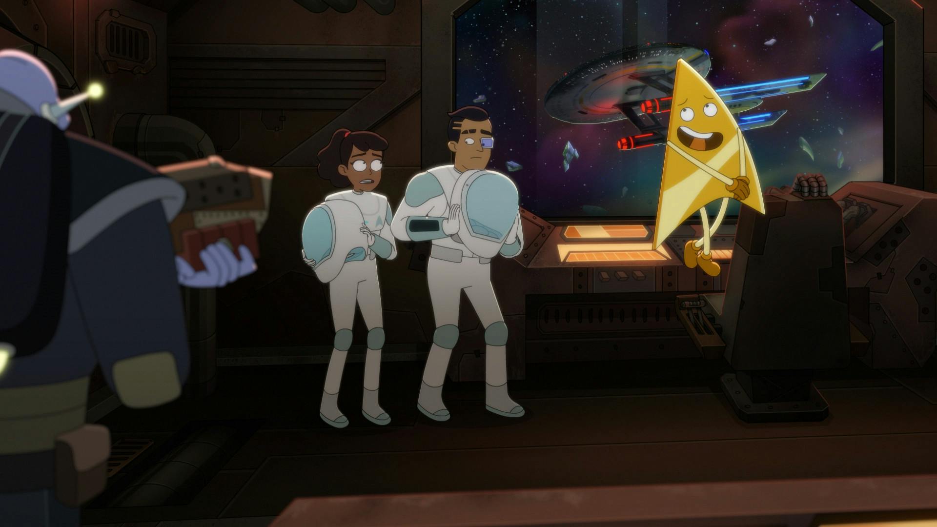 A worried Mariner and Rutherford in EV suits stand aboard the bridge flanked by a Drookmani with a phaser rifle pointed towards them and Badgey as the Cerritos is on guard on the viewscreen behind them in 'A Few Badgeys More'