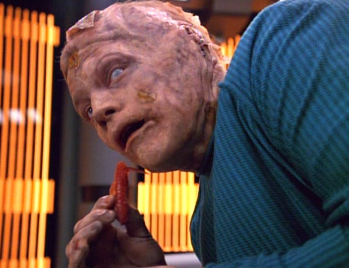 In Voyager's Sickbay, a mutated Tom Paris pulls out his own tongue in 'Threshold'