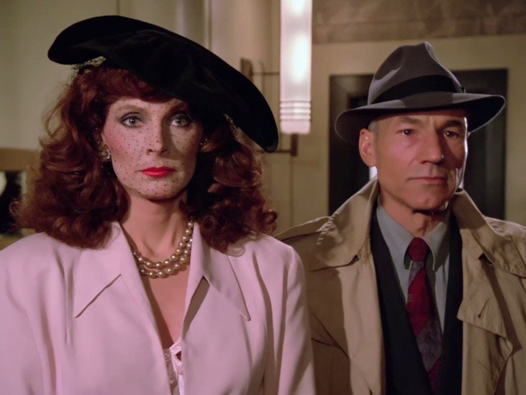 In a Dixon Hill holo-program, Dr. Beverly Crusher and Jean-Luc Picard in outfits from that time period stand side by side in 'The Big Goodbye'