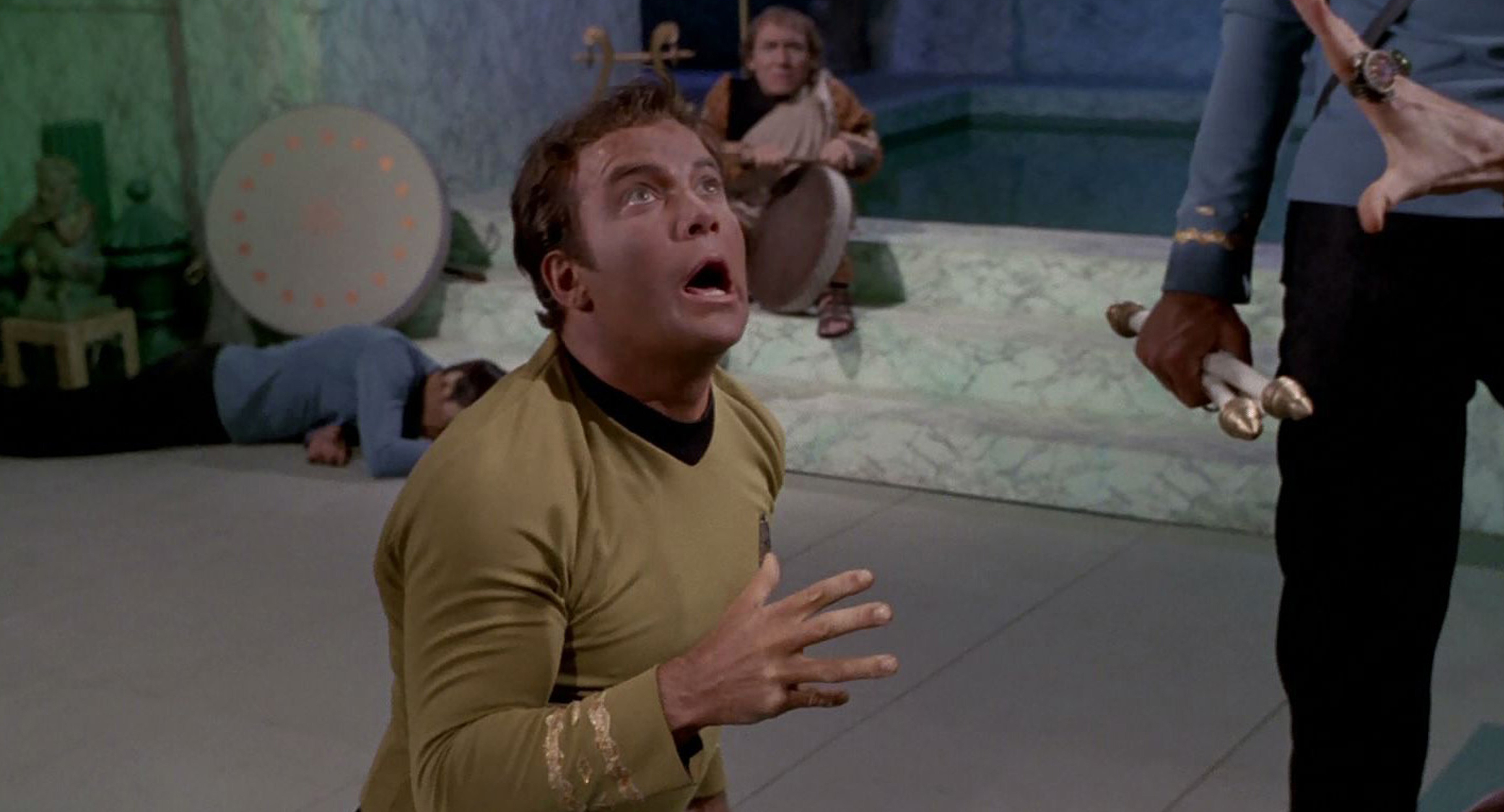 Kirk writhes in pain in Star Trek: The Original Series - Plato's Stepchildren