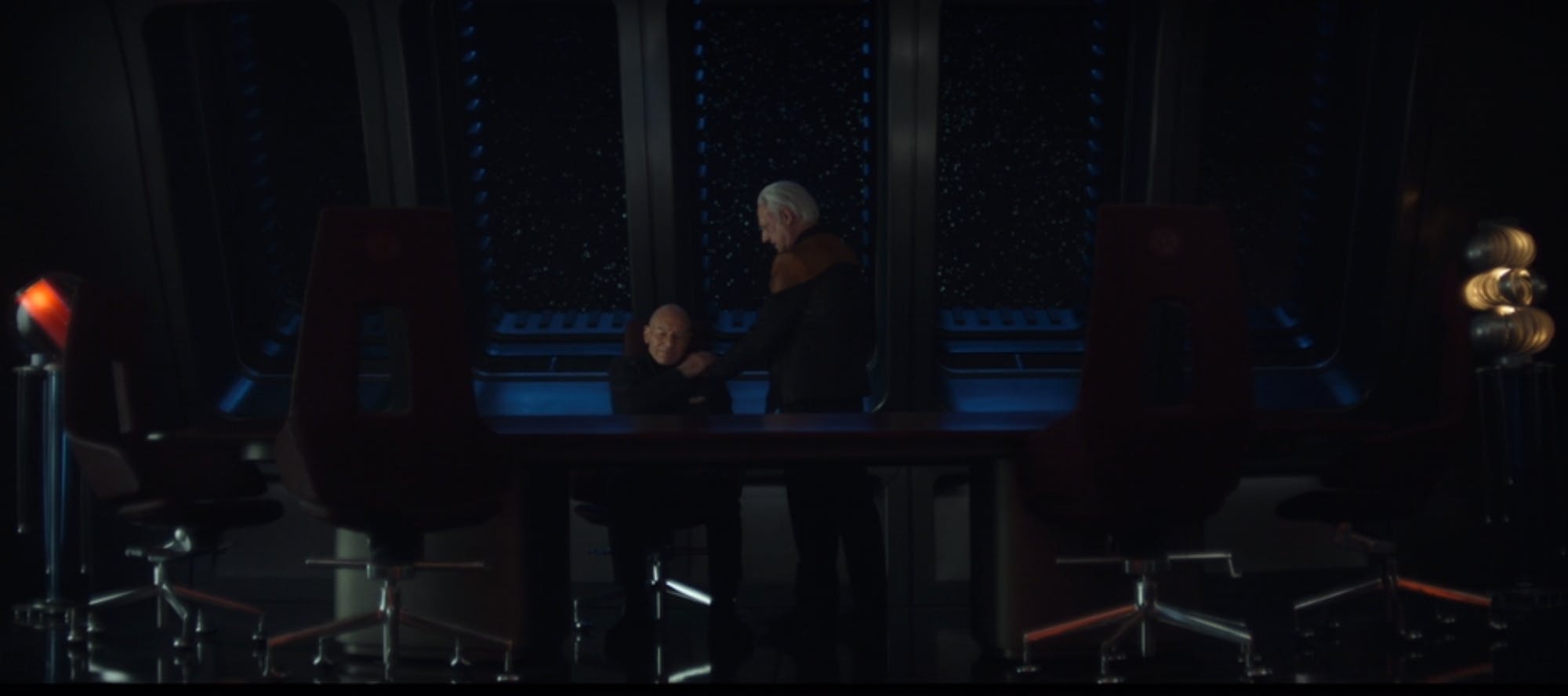 In the Observation Lounge, Data places a comforting hand on Picard's shoulder as he worries in 'Vox'