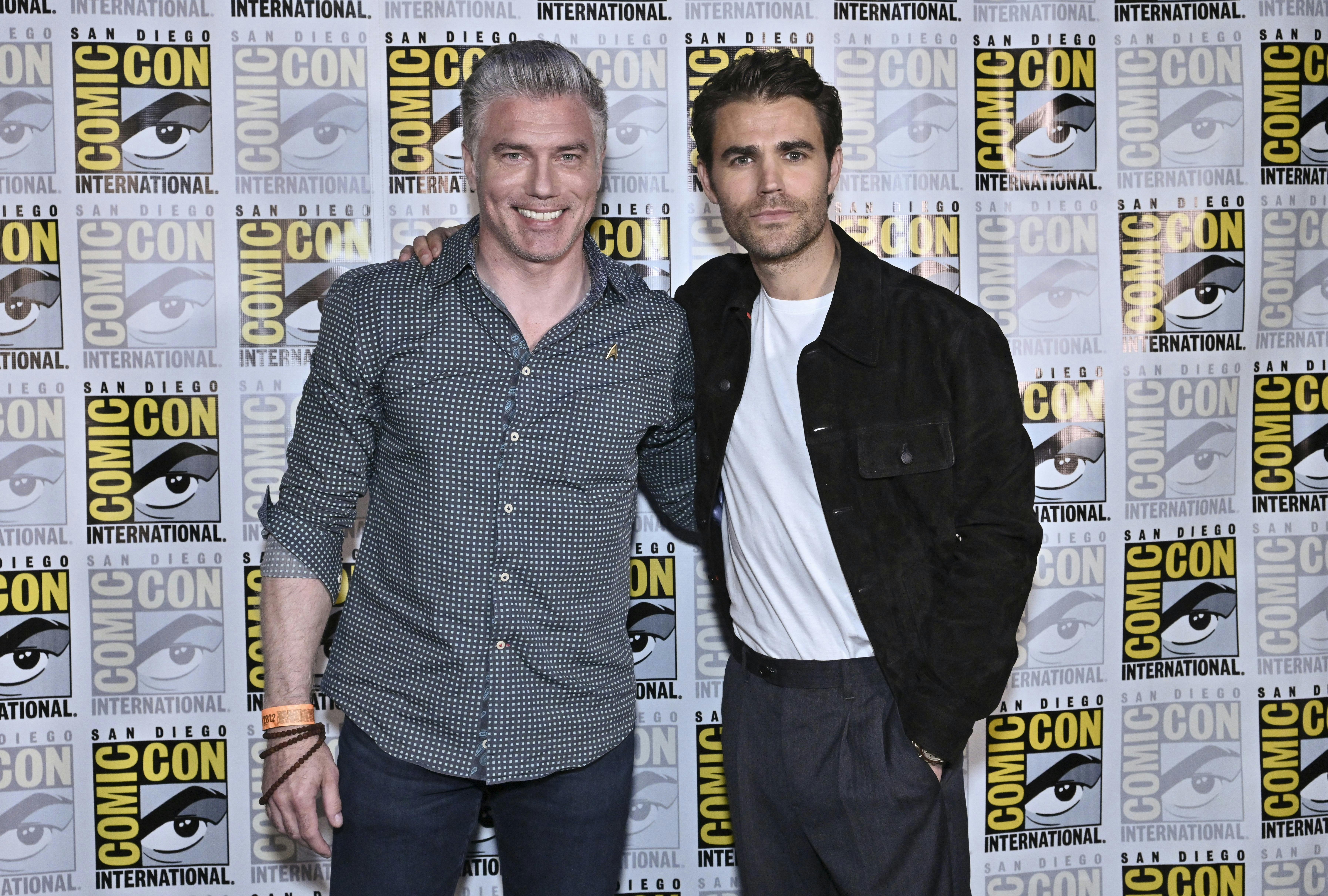 Anson Mount and Paul Wesley pose for a photo.
