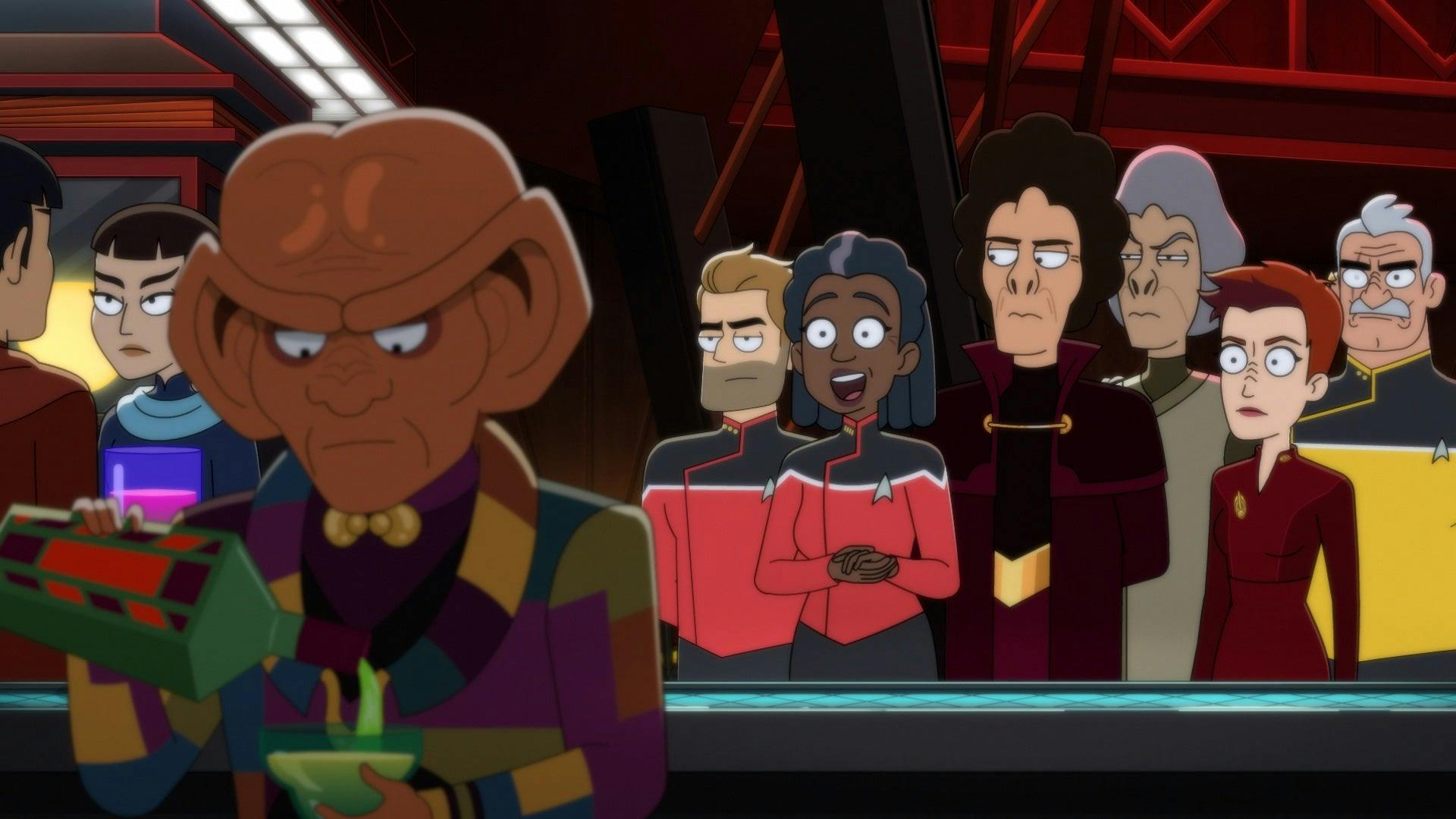 Quark faces away from Captain Freeman, her crew, Kira, and a group of alien dignitaries.