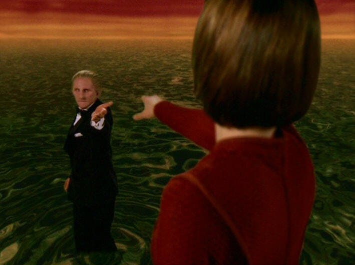 Odo in a tux and Kira say goodbye as he returns to the Great Link in 'What You Leave Behind'