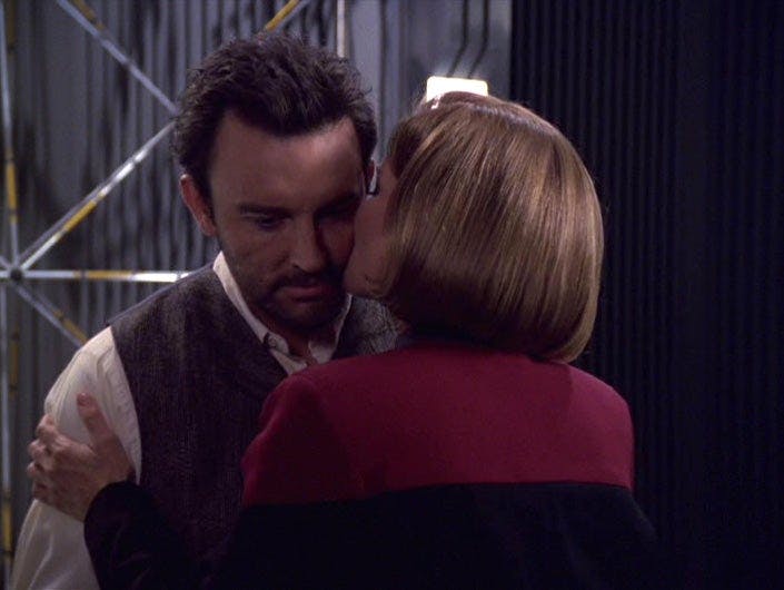 Kissing him on the check, Janeway and hologram Michael Sullvian say goodbye in 'Fair Haven'