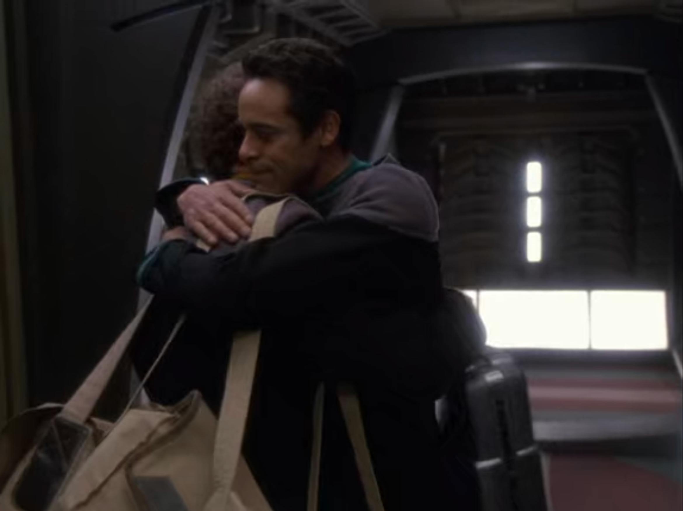 Miles and Julian embrace in a hug and say goodbye on Star Trek: Deep Space Nine