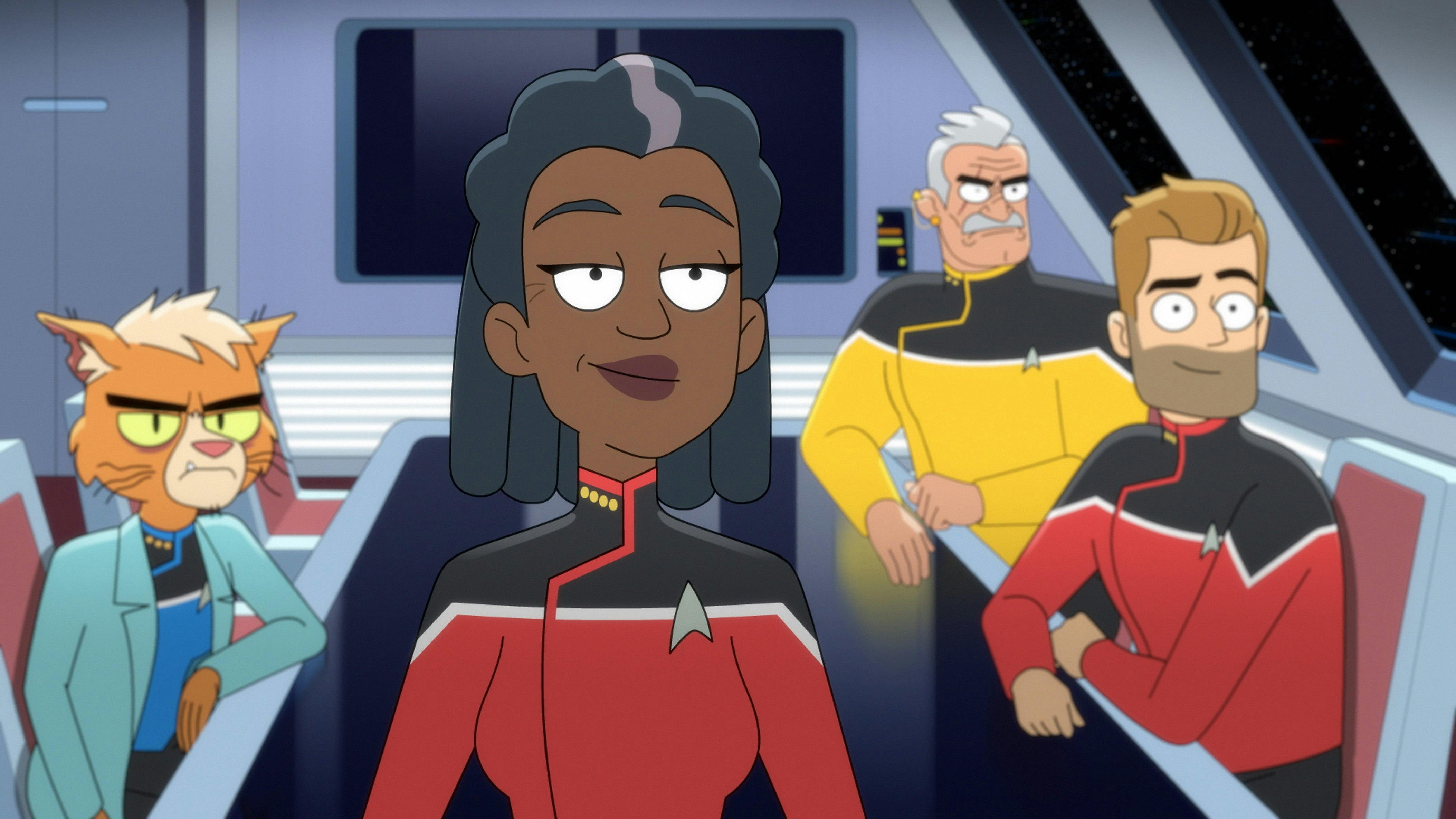Captain Freeman smiles politely. Dr. T'Ana, Lt. Shaxs, and Commander Ransom sit behind her.