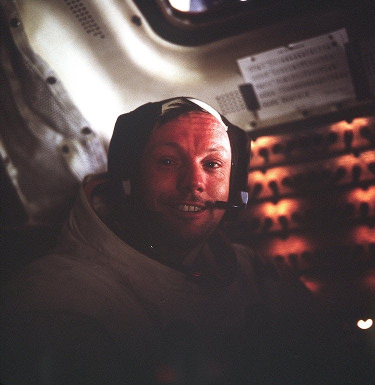 After: On July 20, 1969, Neil Armstrong smiles for a photo by lunar module pilot Buzz Aldrin following their extravehicular activity on the Moon.