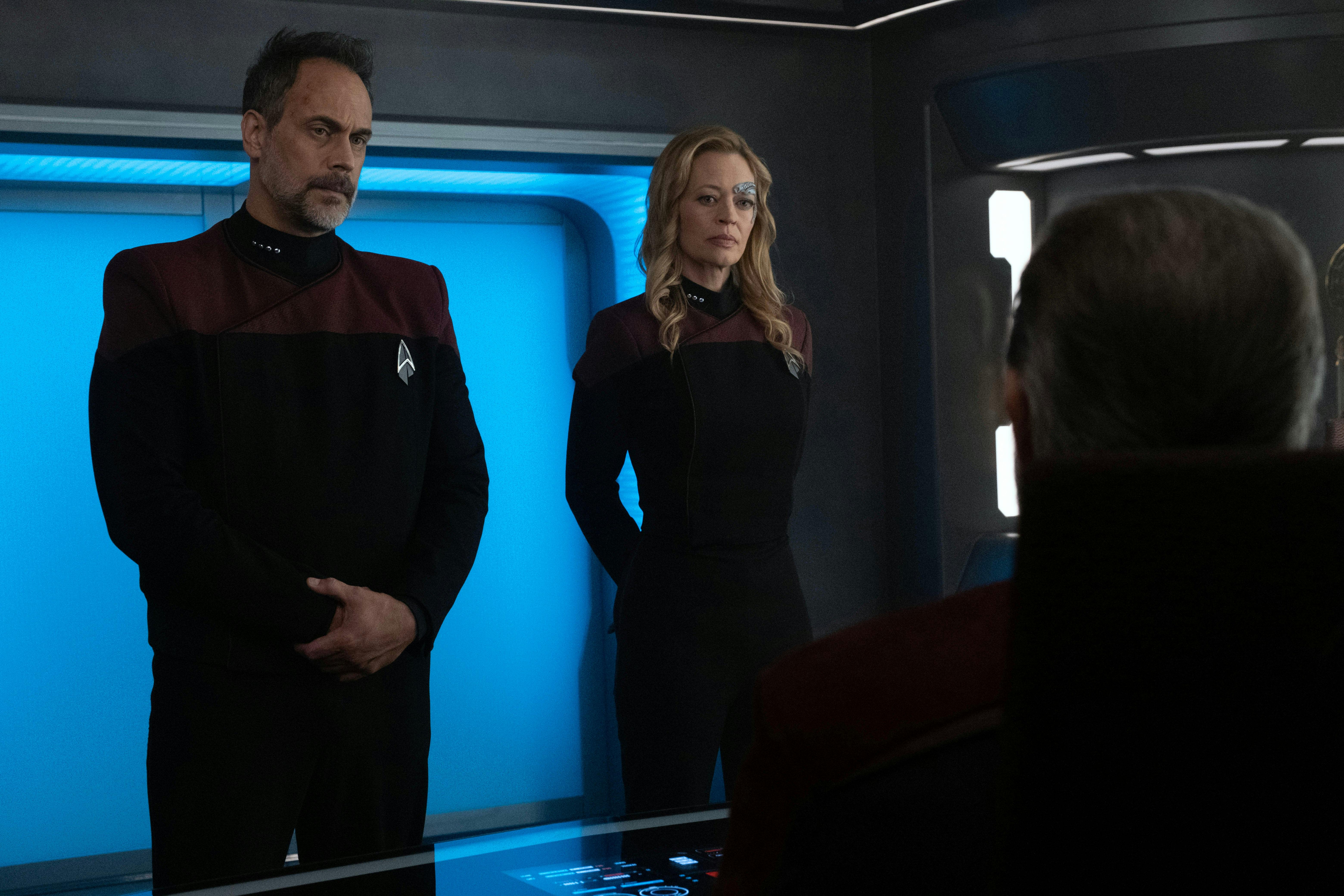 Captain Shaw and Commander Shaw formally stand in front of Picard and Riker in the Titan's Observation Lounge in 'Imposters'