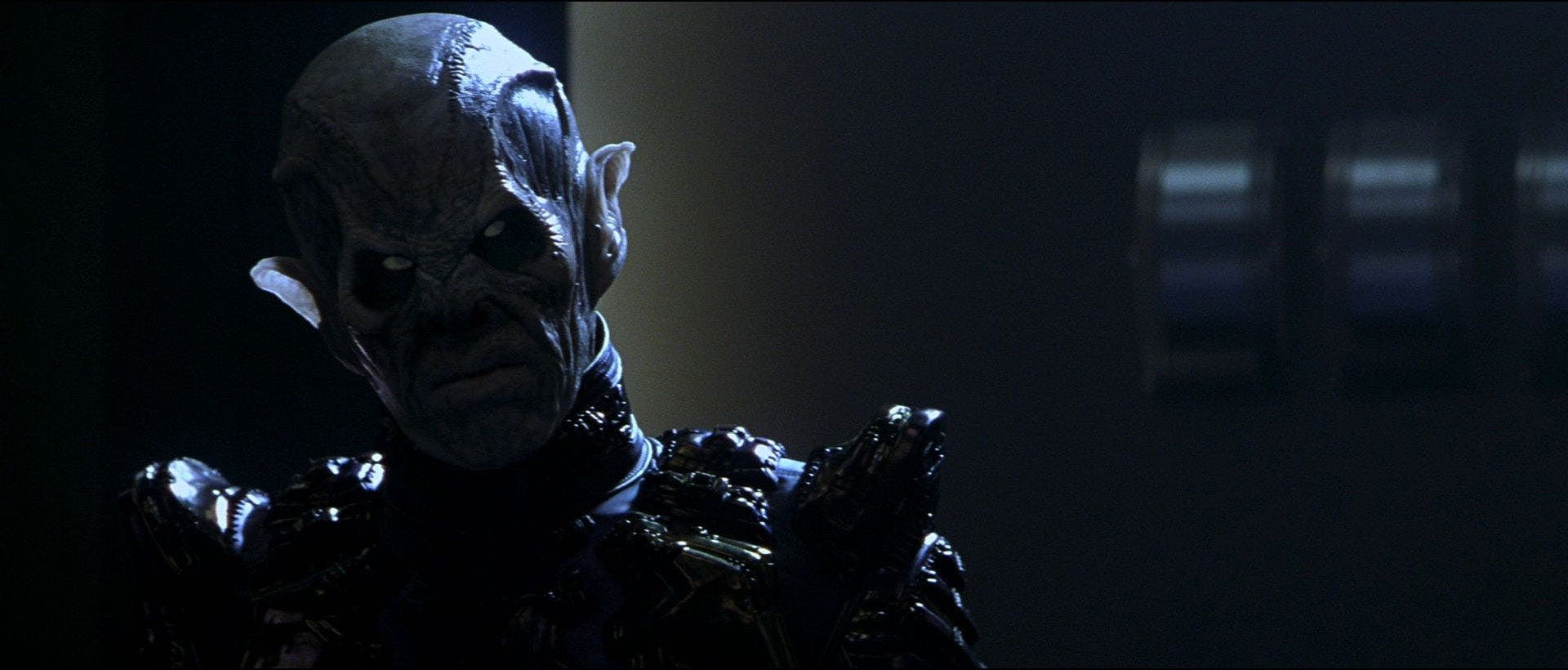 Close-up of a Reman shrouded in the dark, adding to its mysterious nature in Star Trek Nemesis