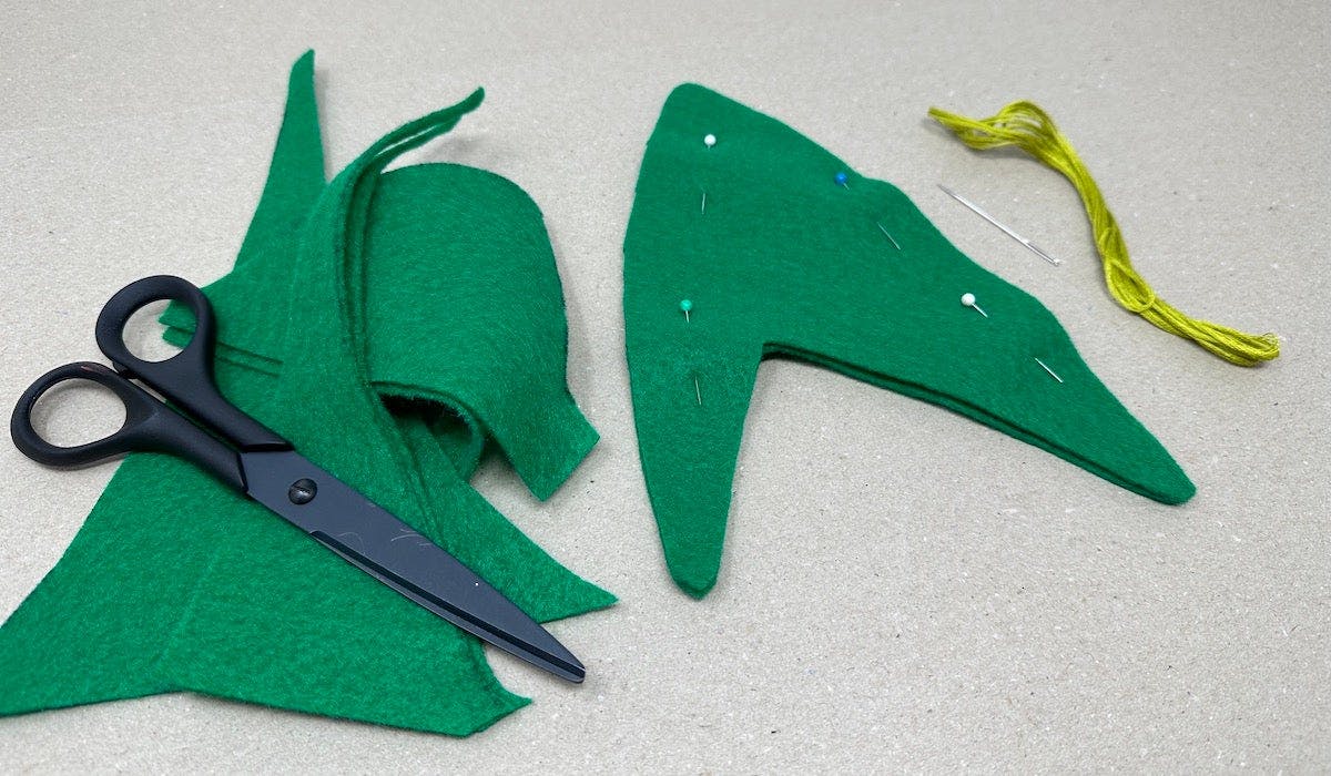 Starfleet Insignia Holiday Craft by Kelly Knox - Cut the traced template on green felt sheet and secure sheets with bobby pins