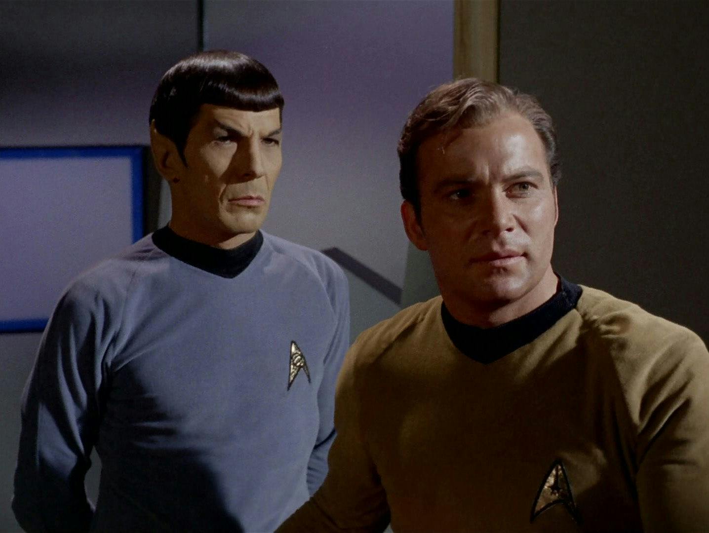 Spock and Kirk look at a new arrival.