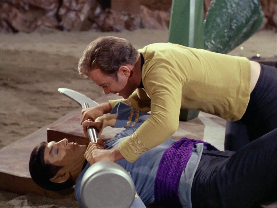Kirk wrestles with Spock and pins him to the ground with a lirpa in 'Amok Time'