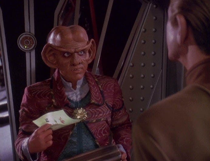 Quark discovers a letter from Rom where his disruptor should be as Odo chides him on Star Trek: Deep Space Nine