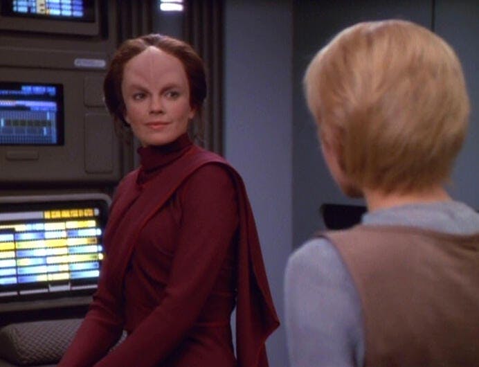 Kes approaches a seated Danara Pel in Sickbay in 'Lifesigns'