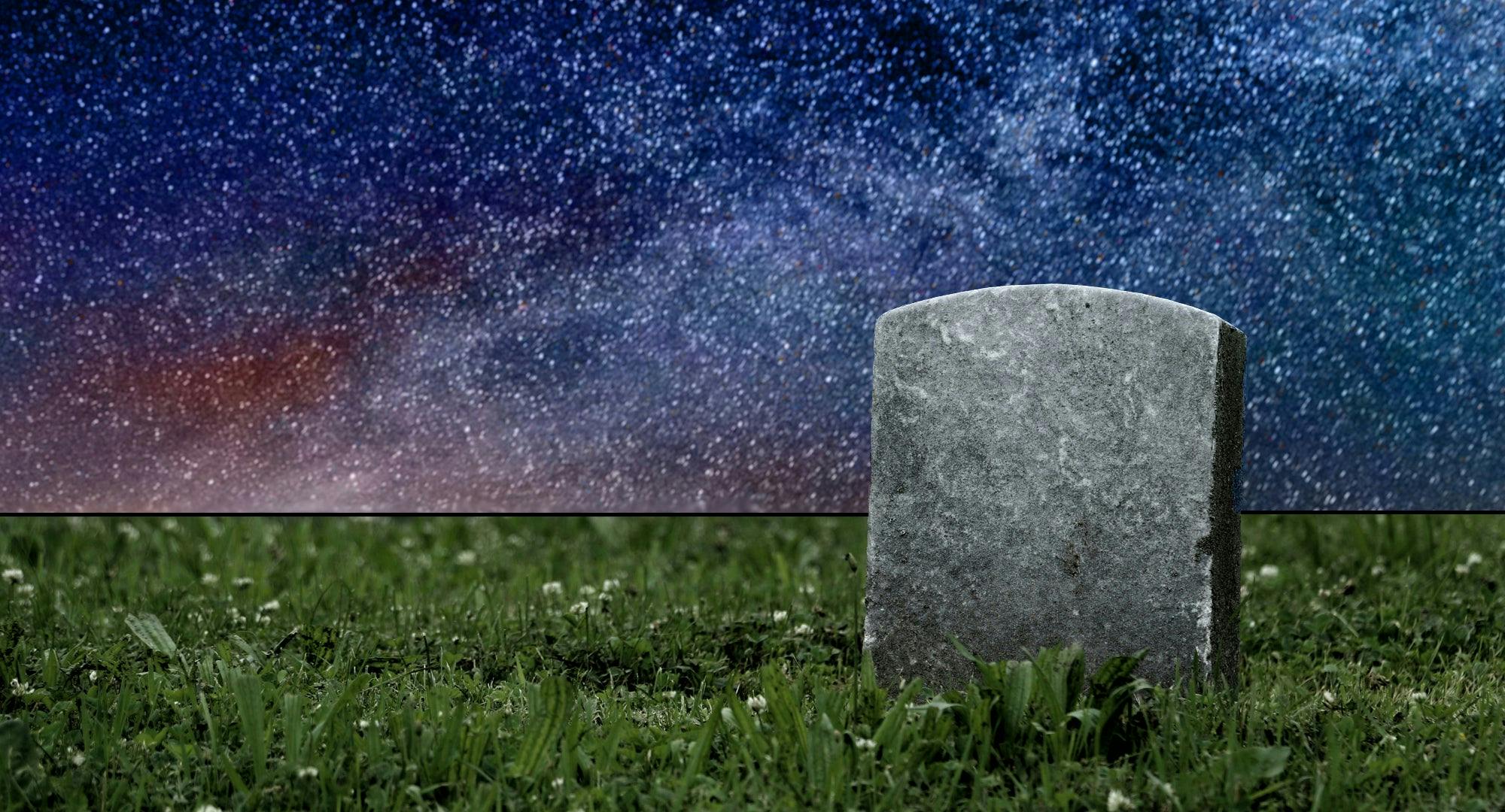 A tombstone surrounded by stars and grass.
