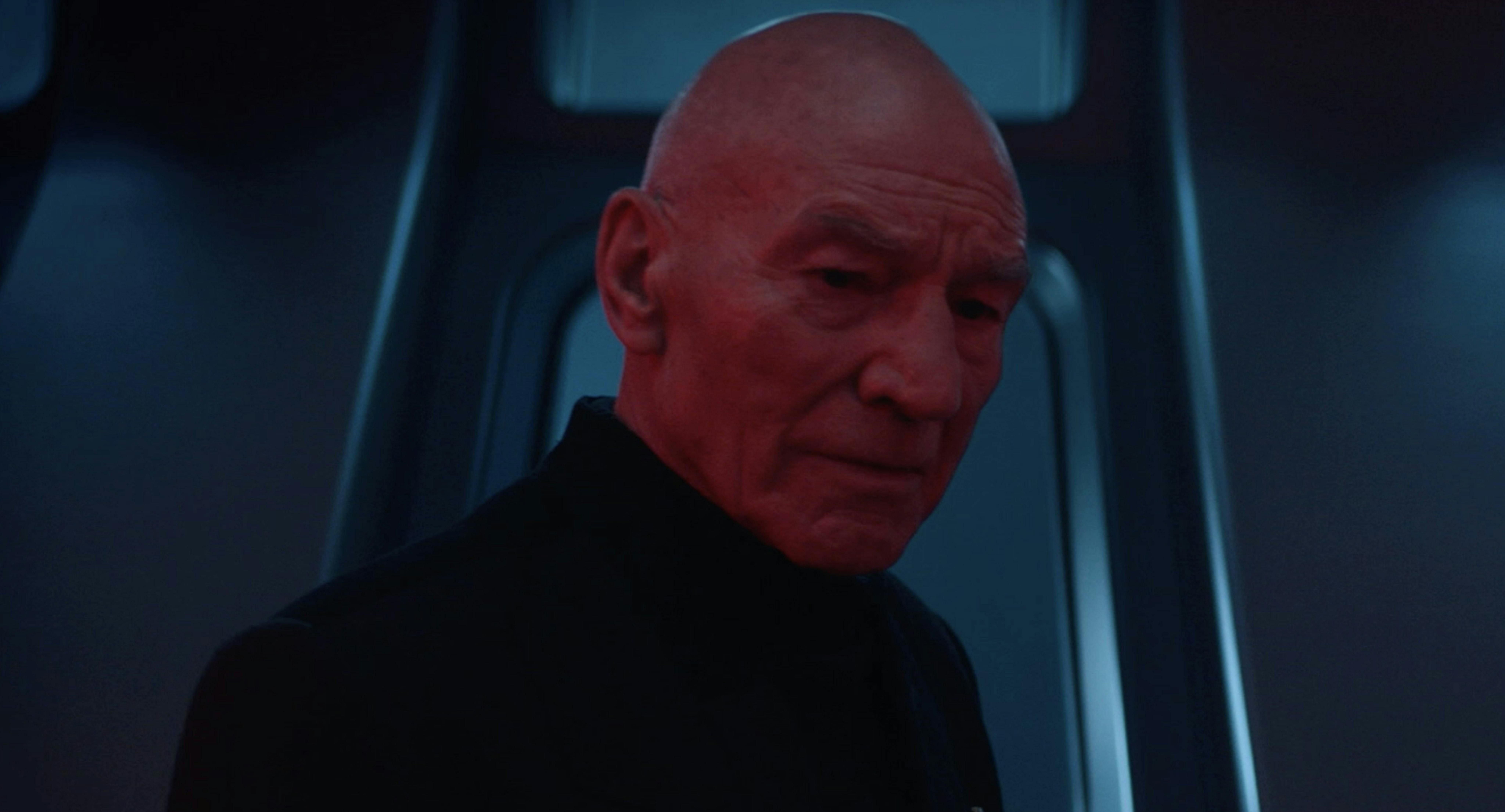 Picard looks down pensively in Star Trek: Picard