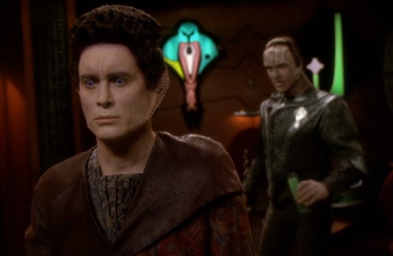 Weyoun 7 stands with his back to Damar conflicted by the situation at hand in 'Treachery, Faith and the Great River'