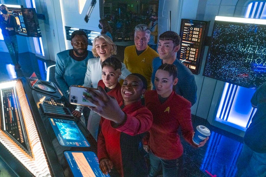 Behind the scenes of the Enterprise bridge set on 'Ad Astra per Aspera' with Babs, Jess Bush, Melissa Navia, Anson Mount, Ethan Peck, Celia Rose Gooding, and Christina Chong taking a selfie