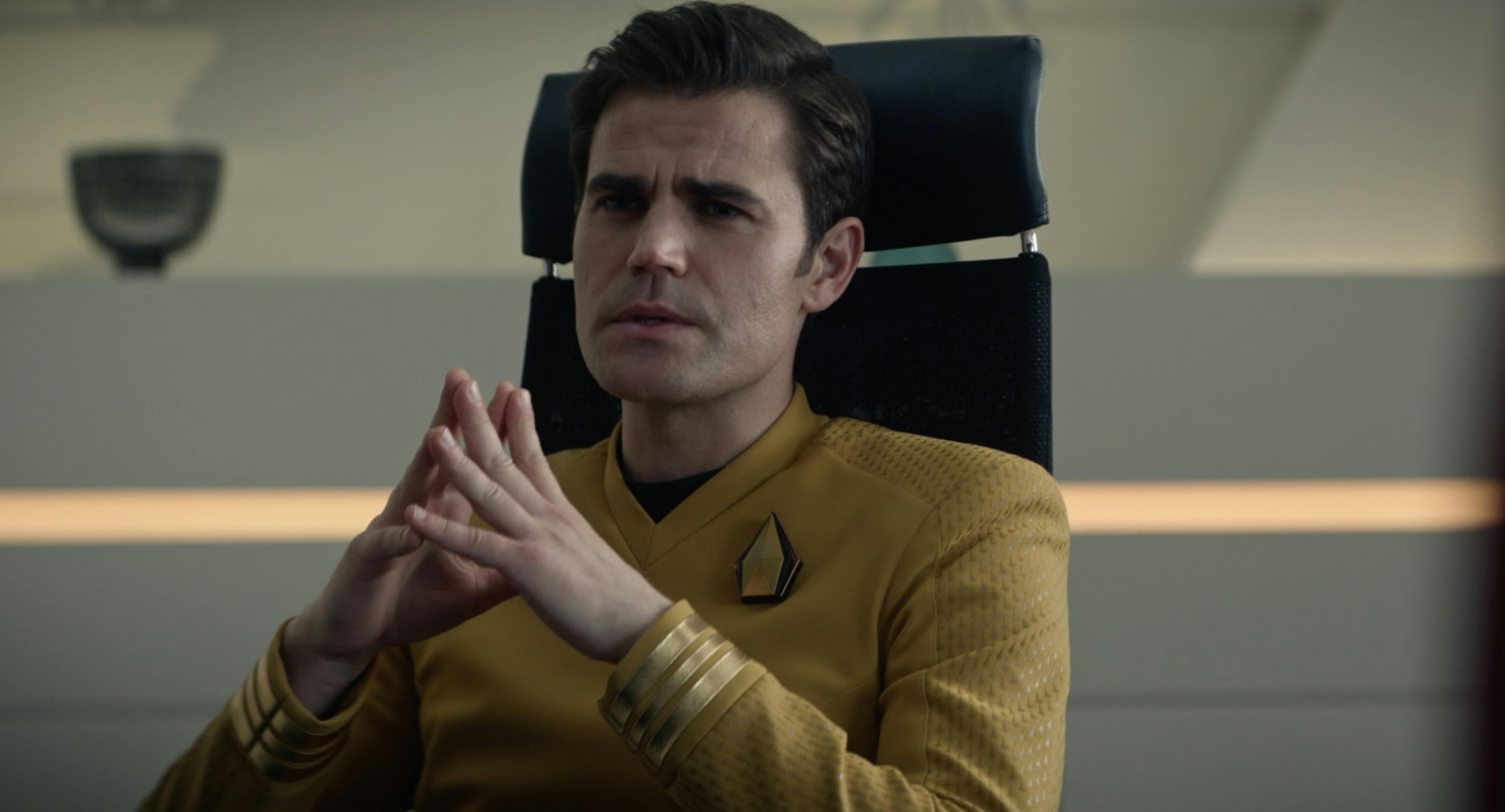 Kirk sits in the Enterprise Ready Room with his hands facing each other, fingers touching in 'Tomorrow and Tomorrow and Tomorrow'