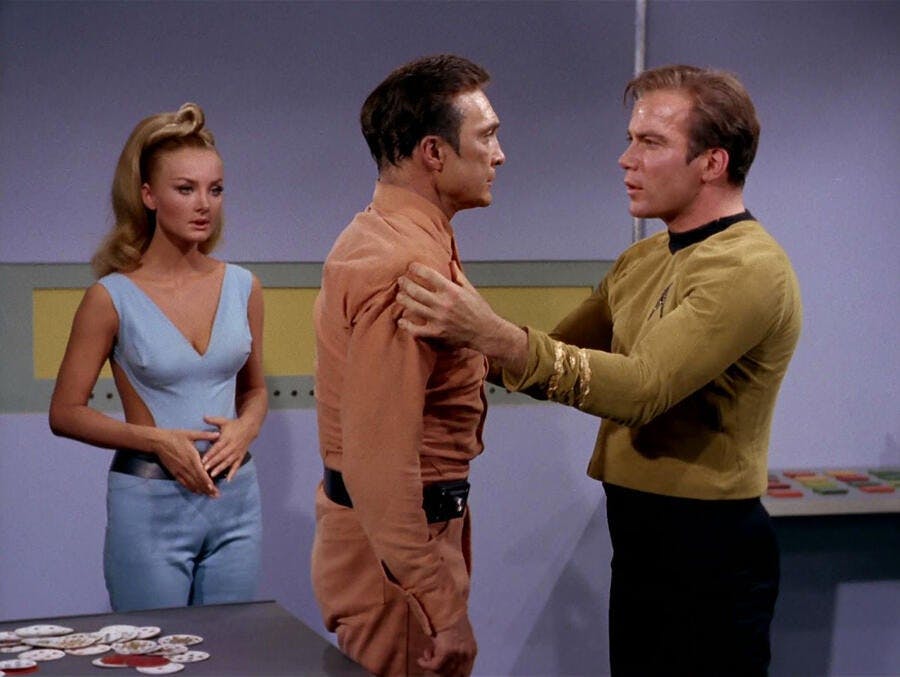 Kirk grips Rojan's arms as he offers a proposal of help in 'By Any Other Name'