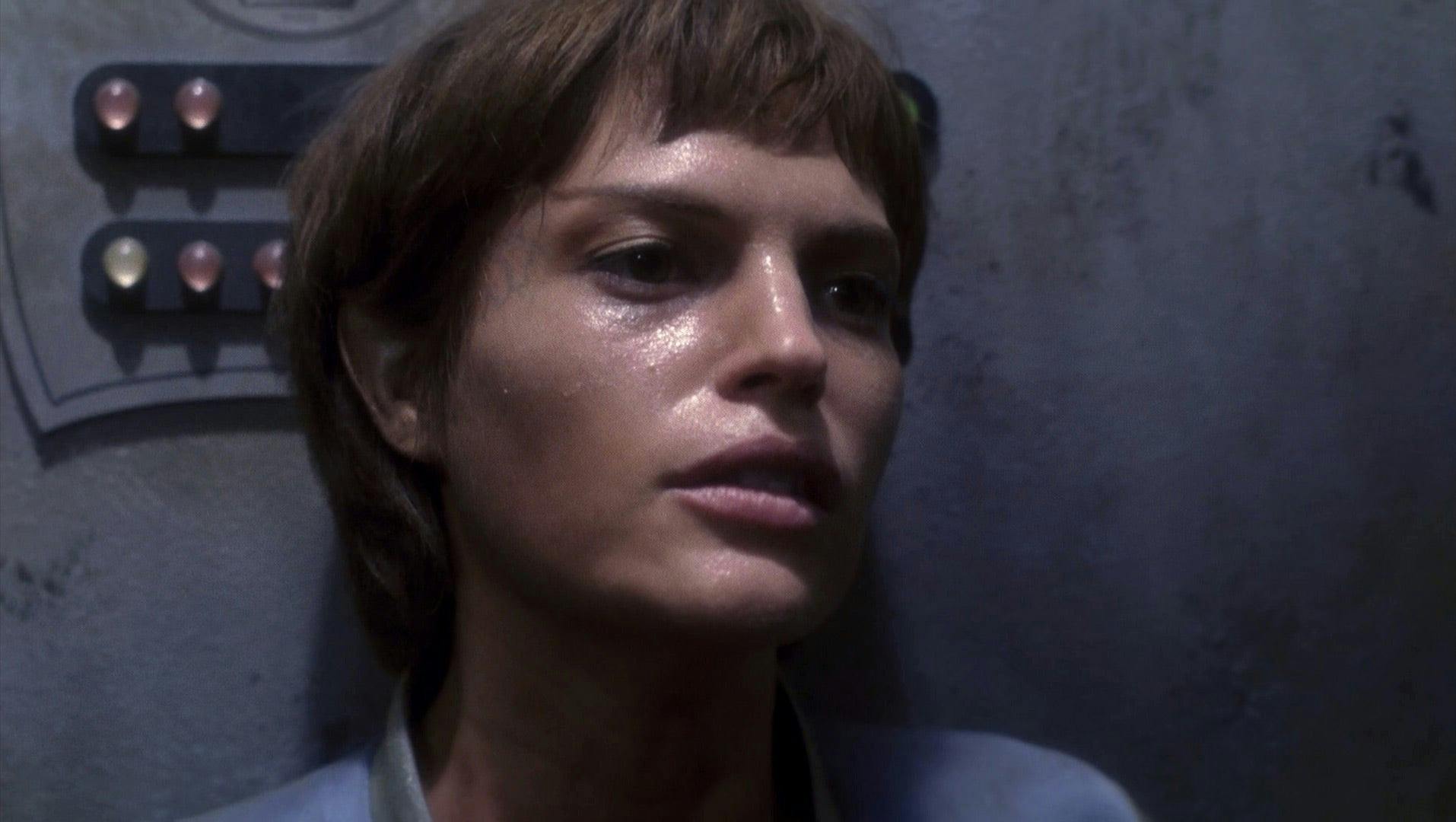 T'Pol is in close up. She looks pale and visibly ill.