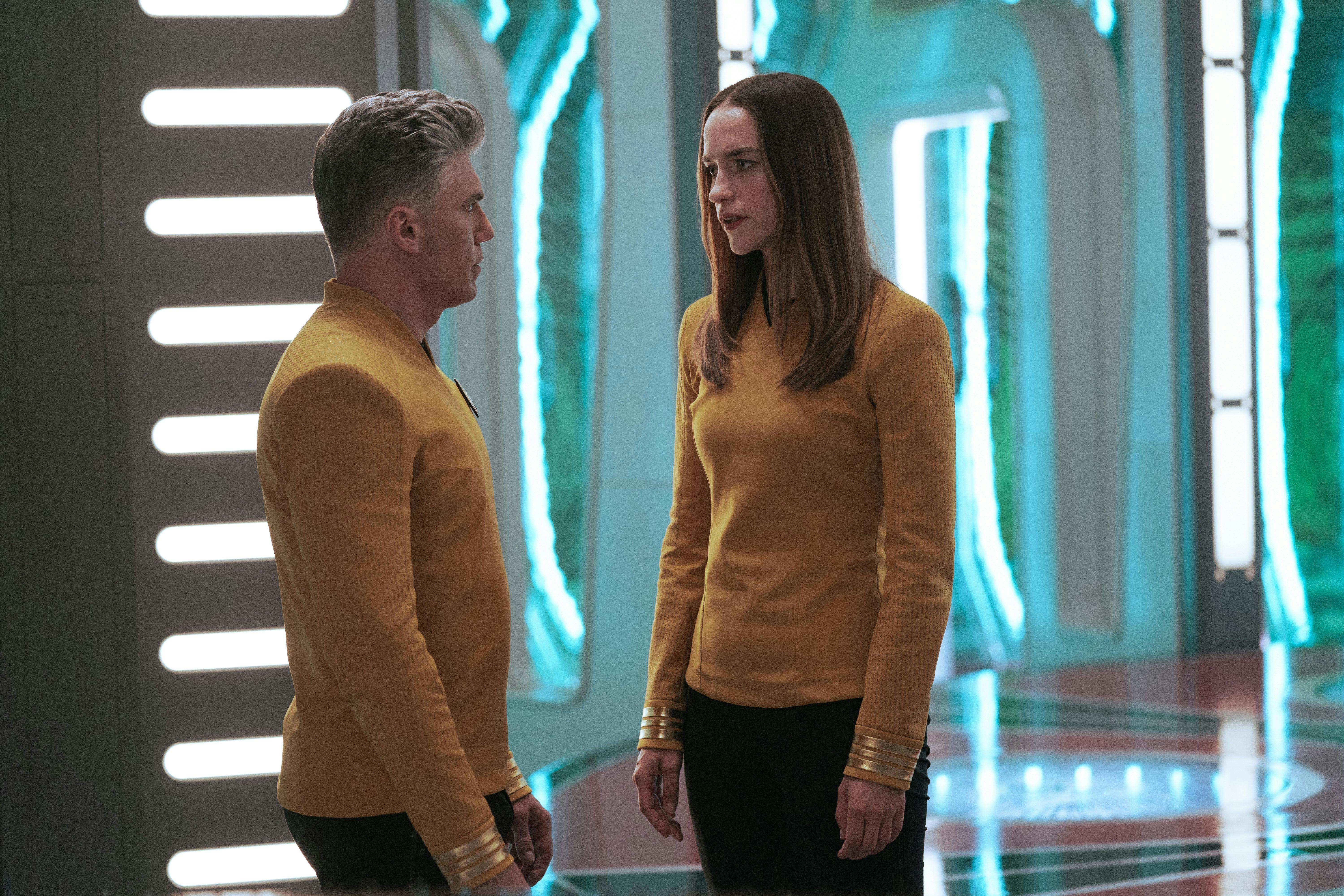Captain Pike (Anson Mount) has a serious conversation with Captain Batel in the transporter room.