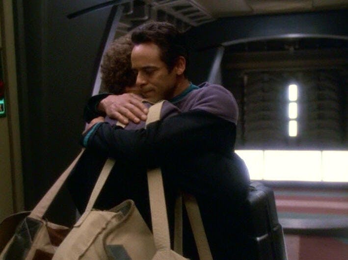 Julian Bashir hugs Miles O'Brien during their farewell in 'What You Leave Behind'