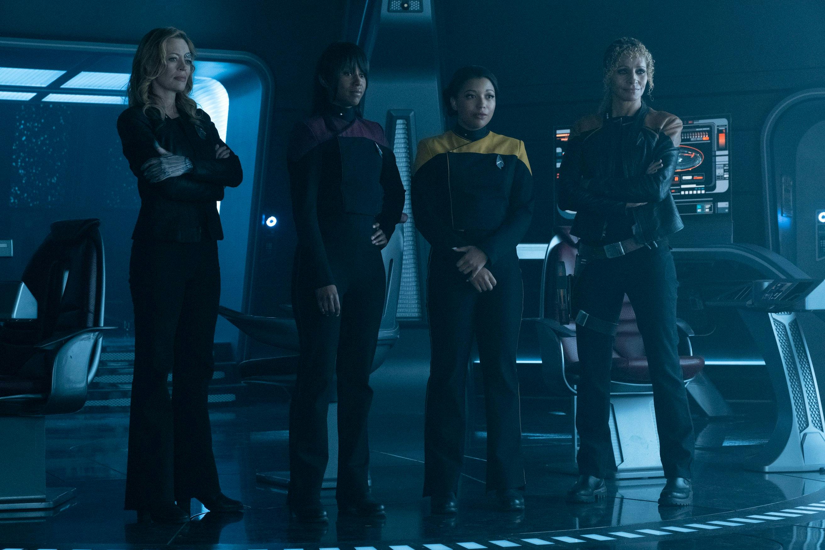 On the Titan bridge, Seven, Sidney and Alandra La Forge, and Raffi stand at command looking forward in 'The Last Generation'