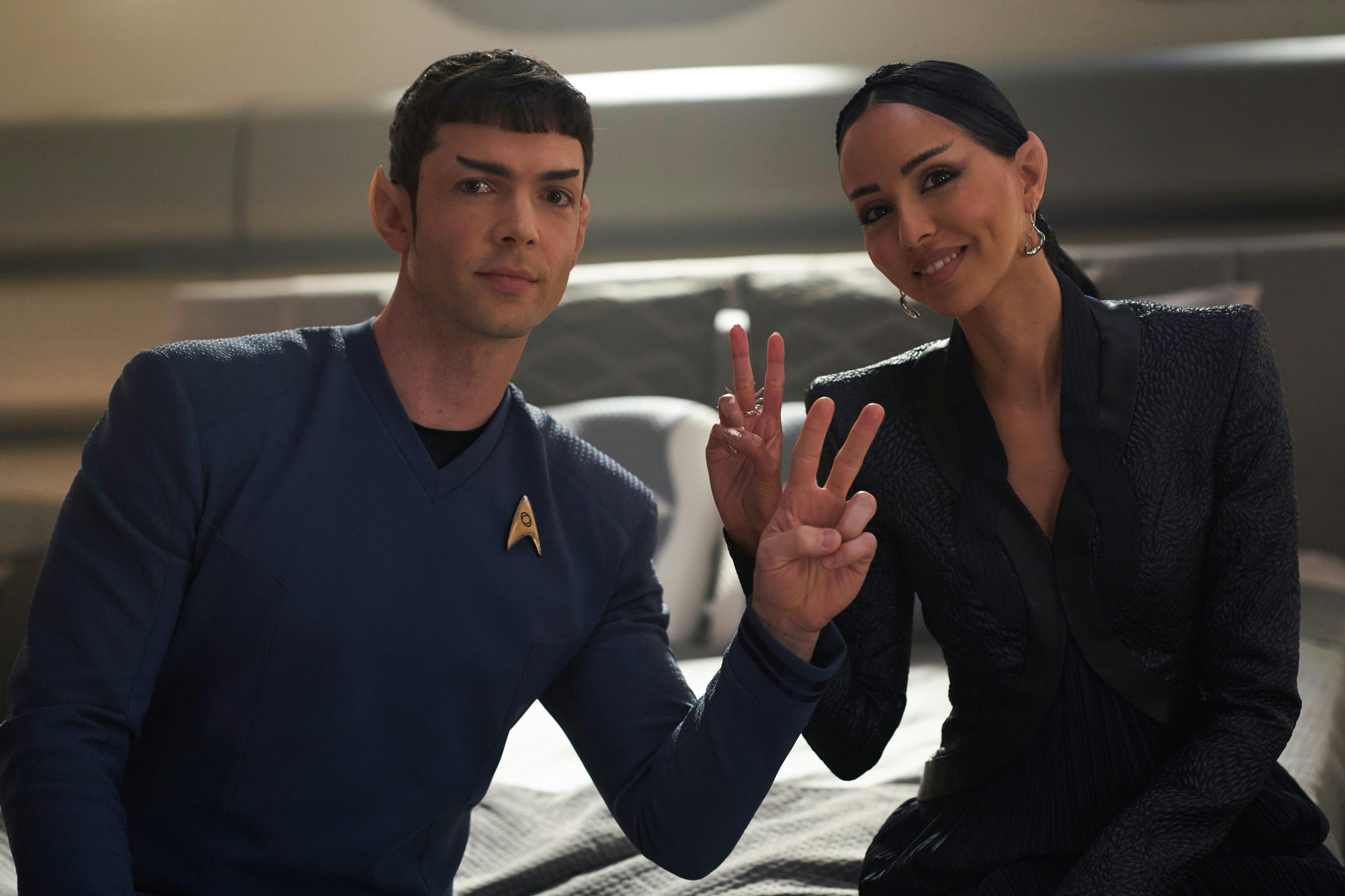 Ethan Peck and Gia Sandhu pose after filming a scene.