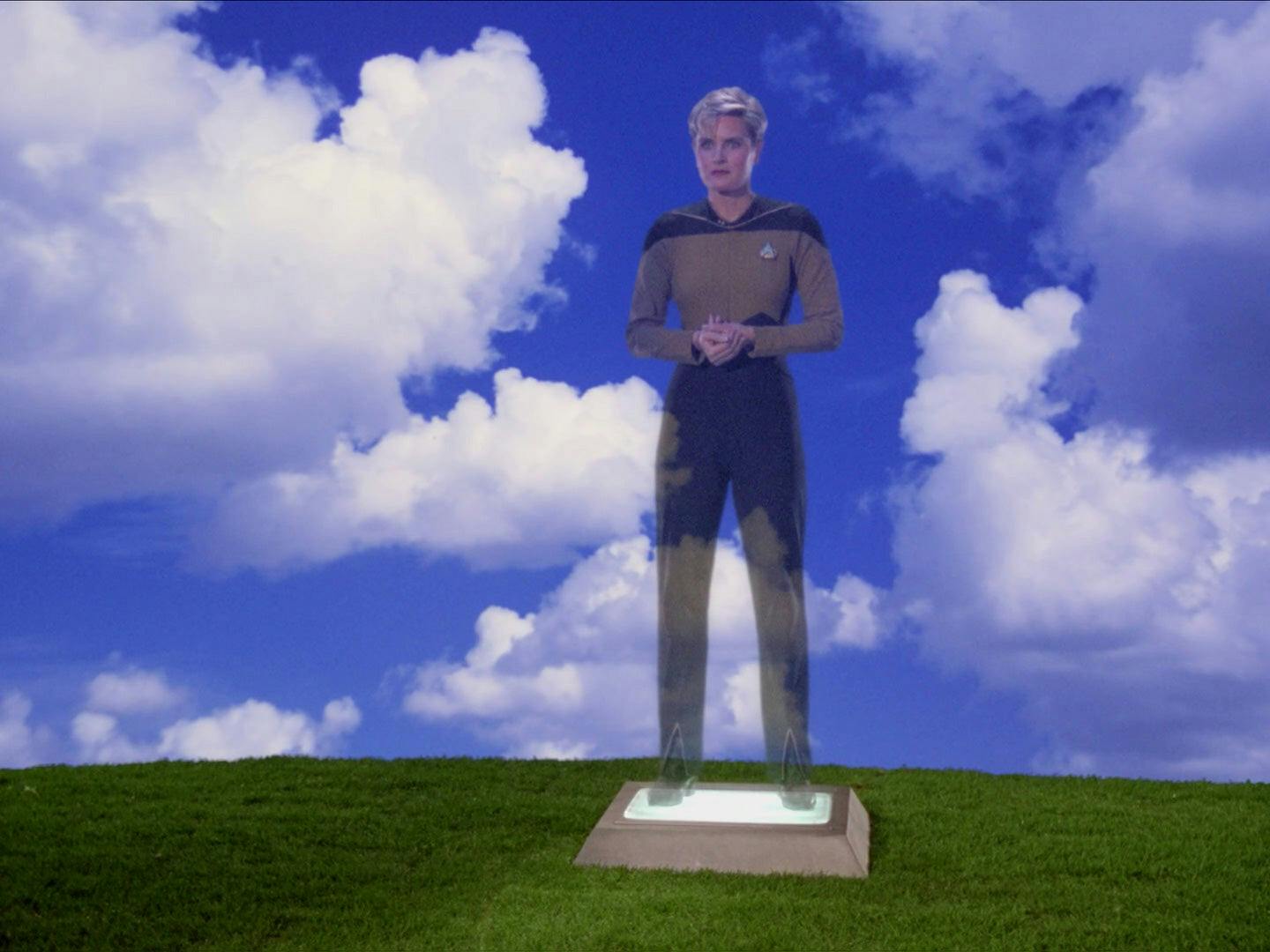 A hologram of Tasha Yar playing a video message at her funeral in 'Skin of Evil'