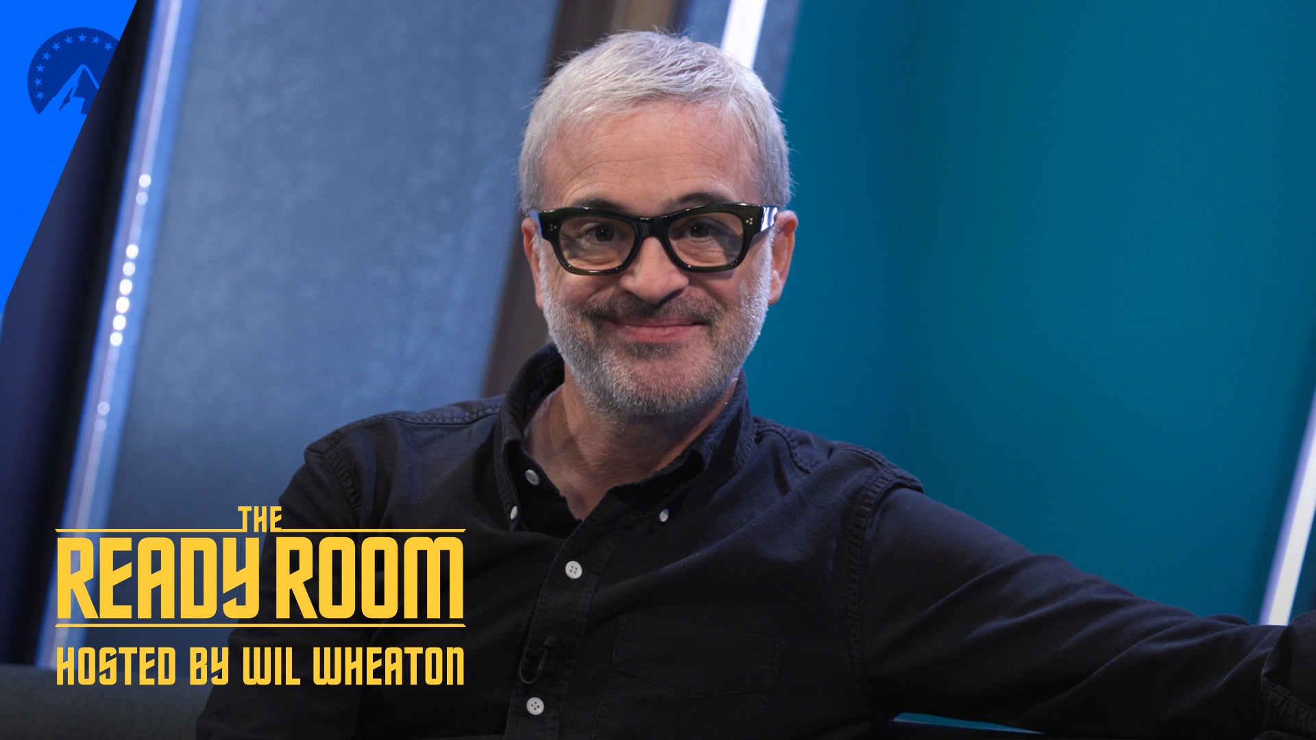 Alex Kurtzman smiling into the camera, The Ready Room logo bottom left corner.