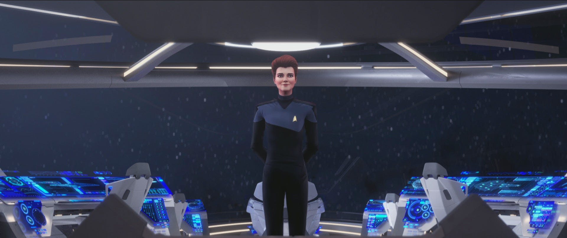 Holo-Janeway faces with her back to the viewscreen, standing proud on Star Trek: Prodigy