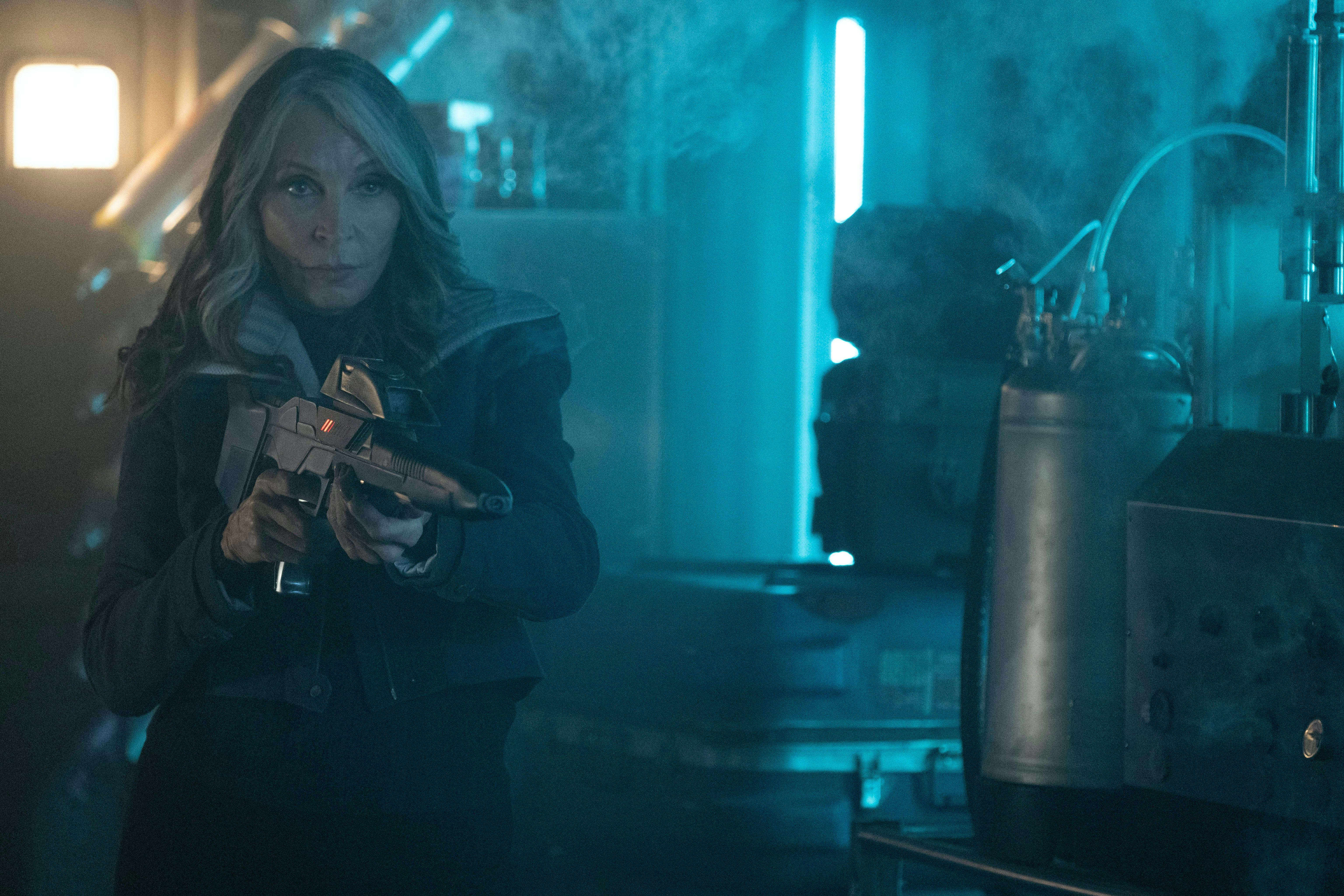 Star Trek: Picard 'The Next Generation' - Beverly Crusher holds her blaster in a defensive stance