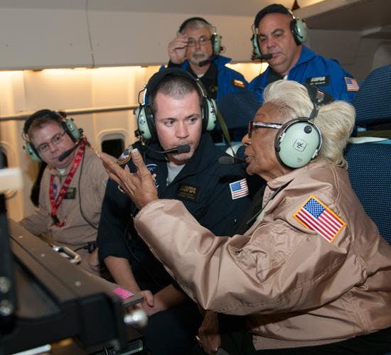 Nichelle Nichols and SOFIA scientist Andrew Helton discuss how SOFIA’s instruments capture infrared energy from star forming regions during the Sept. 15 flight. Looking on, from left: SOFIA instrument scientist Joe Adams, seated, and Airborne Astronomy Ambassadors Michael Shinabery, Jeffrey Killebrew, and April Whitt.